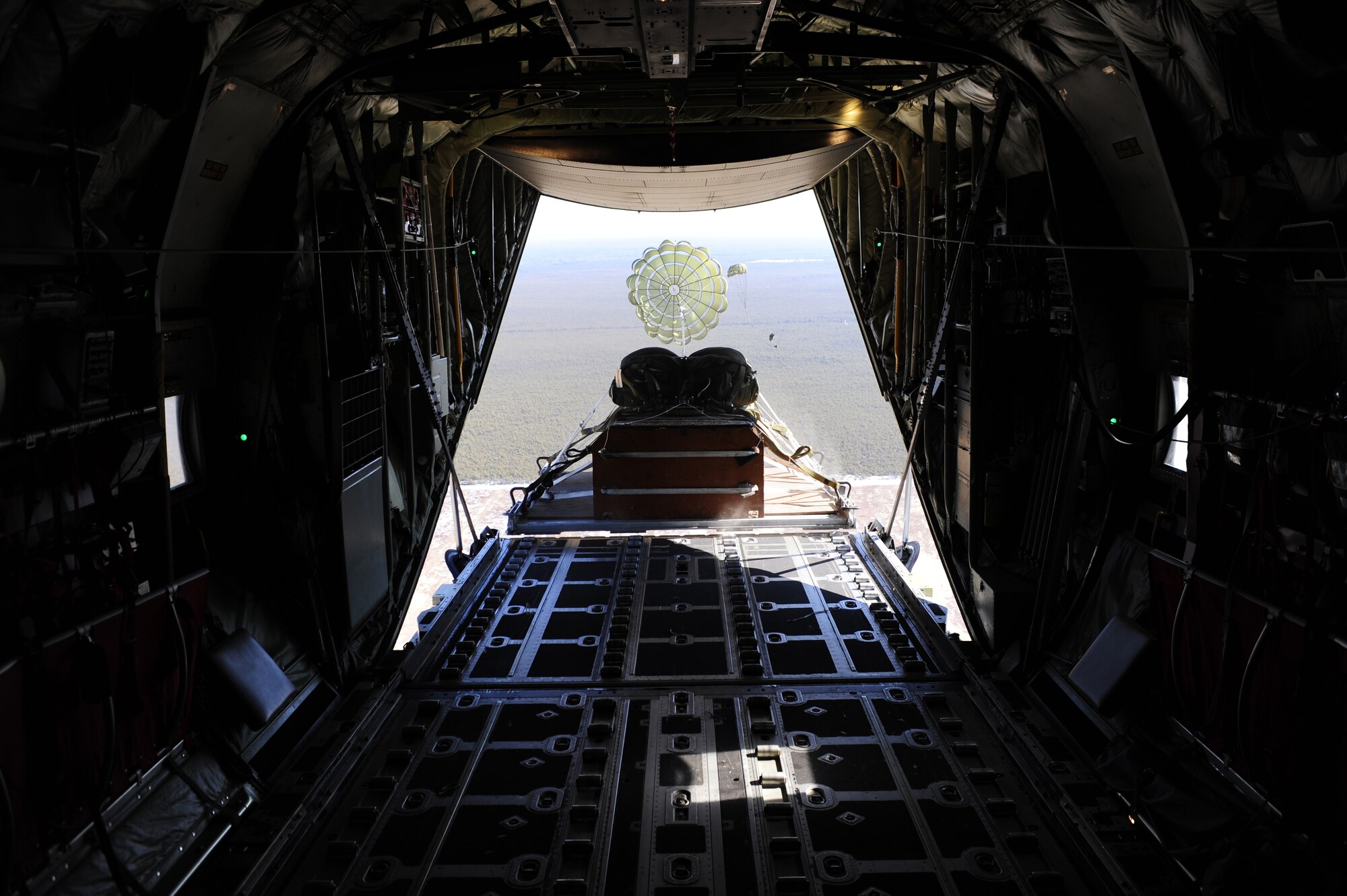 A training load is successfully ejected from an EC-130J from the 193rd Special Operations Squadron during a training sortie Feb. 10, 2011, Harrisburg International Airport, Pa. This flight is one of the first sorties with all crew positions filled by students and tests their crew resource management. (U.S. Air Force photo by Staff Sgt. Julianne M. Showalter/Released)