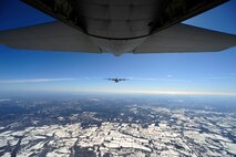 An EC-130J from the 193rd Special Operations Squadron flown by Air Force Special Operations Training Center students class 1101, flies in formation during a training sortie Feb. 11, 2011, Harrisburg, Pa. Class 1101 is the first group of students to attend mission qualification training for the EC-130J that will replace all the E- and P-model aircraft within the next few years. The EC-130 J is equipped with modern avionics, mission systems and a more capable and sustainable airframe that will provide specialized mobility to combatant commanders. (U.S. Air Force photo by Staff Sgt. Julianne M. Showalter/Released)
