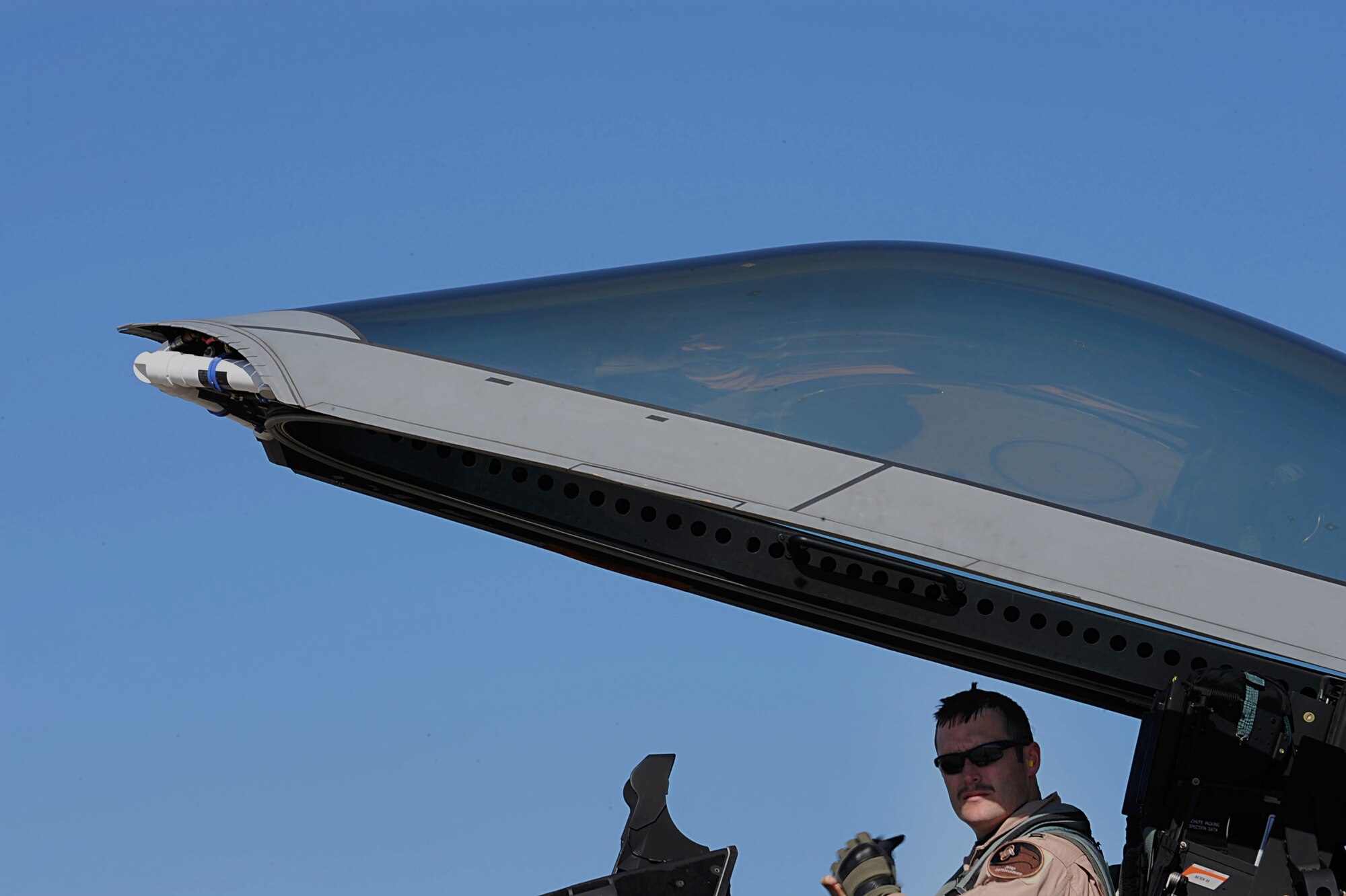 Capt. Charles Bursi, 94th Fighter Squadron training officer,exits his F-22 Raptor at Langley Air Force Base, Va., March 1, 2011. The 94th Fighter Squadron pilots return from Southwest Asia and are greeted by friends and family members. (U.S. Air Force photo by Senior Airman Brian Ybarbo/Released)
