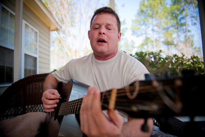 Master Sgt. Robert Disney performs a rendition of Seether's "Breakdown" Feb. 24, 2011, at his home. Sergeant Disney began performing at local venues in town during his first assignment to Moody Air Force Base, Ga., from 1998 to 2004. Sergeant Disney is the 347th Rescue Group standards and evaluations superintendent. (U.S. Air Force photo/Staff Sgt. Jamal D. Sutter)
