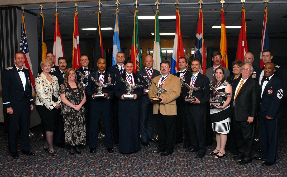 Recipients of 80th Flying Training Wing annual awards stand together Feb. 19 following a banquet at the Sheppard Club. Those pictured include (front row, left to right) Maj. Gen. Mark Solo, 19th Air Force commander; Tee Mueller, Embry-Riddle Aeronautical University; Sharon Walker, Sheppard Bank; Master Sgt. James Jones, 80th Operations Group; Tech. Sgt. Rebecca Logan, 80th Operations Support Squadron; Mark Bice, 80th OSS; William Tisdale, 80th OSS; Tracy Dorgan, 88th Fighter Training Squadron; Lady Dee Ann Martin and Sir Noros Martin, Advantage Realtor Group; and Chief Master Sgt. Phillip Browning, 80th FTW command chief; (back row, left to right) Tech. Sgt. Jason Baros, Euro-NATO Joint Jet Pilot Training Program Top IV; Master Sgt. Scott Turner, Air Force Sergeants Association; Capt. Aaron Tillman, Company Grade Officer of the Year; Senior Airman Jeffery Lemaire, 80th OG; Capt. Jeffry Kooij, 459th Flying Training Squadron; Maj. Martin Bohn, 459th FTS; Stephen Myers, 80th FTW Wing Staff Agencies; Master Sgt. Jimmy Summers, 80th FTW; and Col. Kevin Schneider, 80th FTW commander.