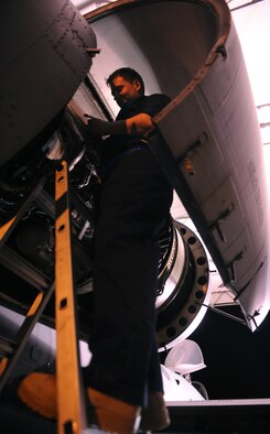 MOODY AIR FORCE BASE, Ga.-- Senior Airman Ben Jones, 74th Aircraft Maintenance Unit crew chief,  prepares to remove the covering from an A-10C Thunderbolt II jet engine during recent maintenance. Third-shift maintainers worked through the night to tear down the A-10 for inspection. (U.S. Air Force photo/Airman 1st Class Benjamin Wiseman)(RELEASED)
