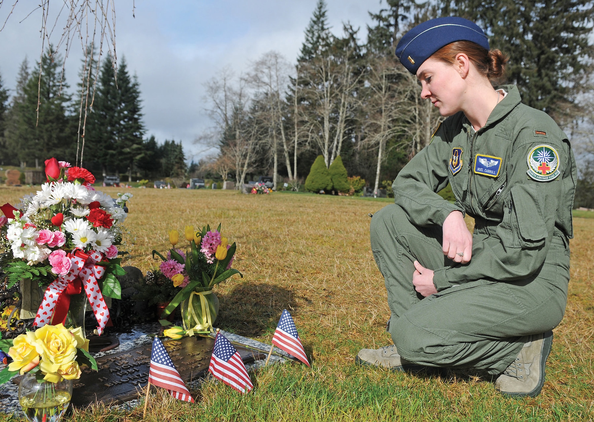 Second Lt. Noel Carroll, 446th Aeromedical Evacuation Squadron flight nurse, McChord Field, Wash., visits her brother's grave in Montesano, Wash. where they grew up. Staff Sgt. Timothy P. Davis was a combat controller who died in combat in Afghanistan, February 2009. Lieutenant Carroll shares a similar story with another nurse in her squadron, Capt. Beverly Davidson, whose former husband was a pararescueman who died in a helicopter crash eight years ago while saving lives. The two nurses joined the Air Force Reserve for that purpose ... to save lives. (Courtesy photo/MacLeod Pappidas of The Daily World)