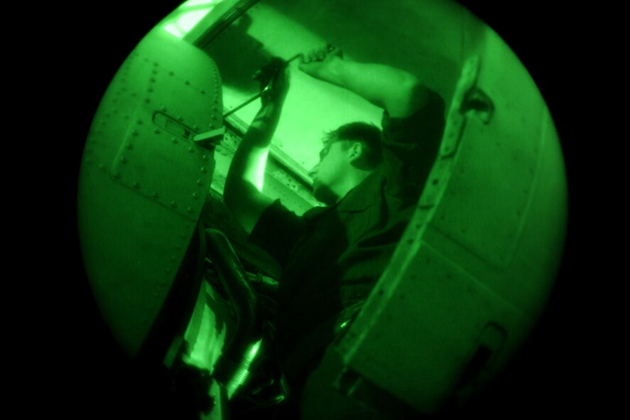 MOODY AIR FORCE BASE, Ga.-- Senior Airman Ben Jones, 74th Aircraft Maintenance Unit crew chief, removes a panel from the engine cover of an A-10C Thunderbolt II during maintenance recently. The 74th and 75th AMUs maintain aircrafts during the day and night with three rotating shifts. (U.S. Air Force photo/Airman 1st Class Benjamin Wiseman)(RELEASED)