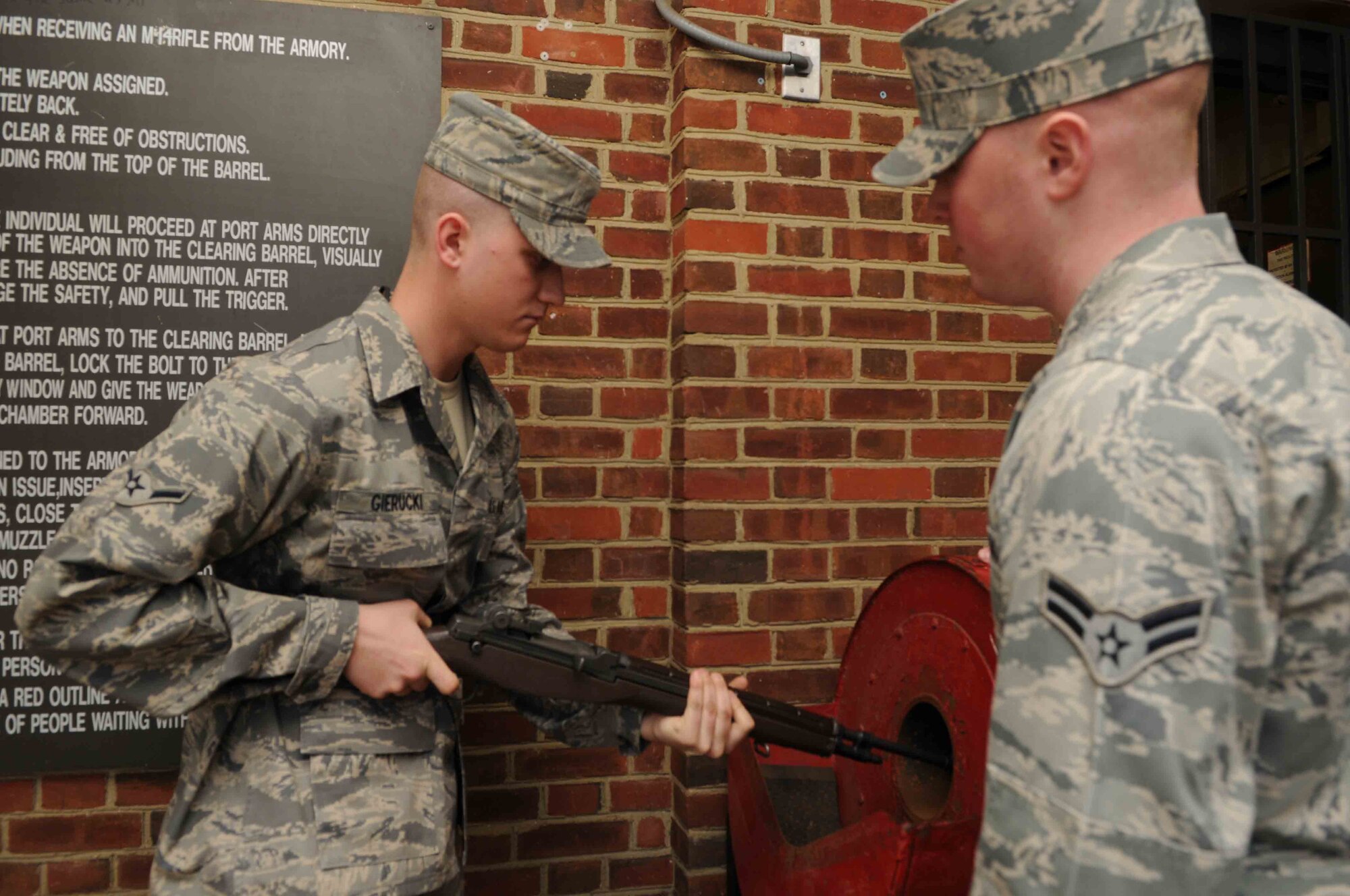 Airman Joshua Gierucki, a trainee in The U.S. Air Force Honor Guard, clears his rifle Feb. 25 at Joint Base Anacostia-Bolling, Washington, D.C. After receiving their rifles, the trainees have to check their rifle to make sure there are no live rounds in the barrel. (U.S. Air Force photo by Senior Airman Christopher Ruano)