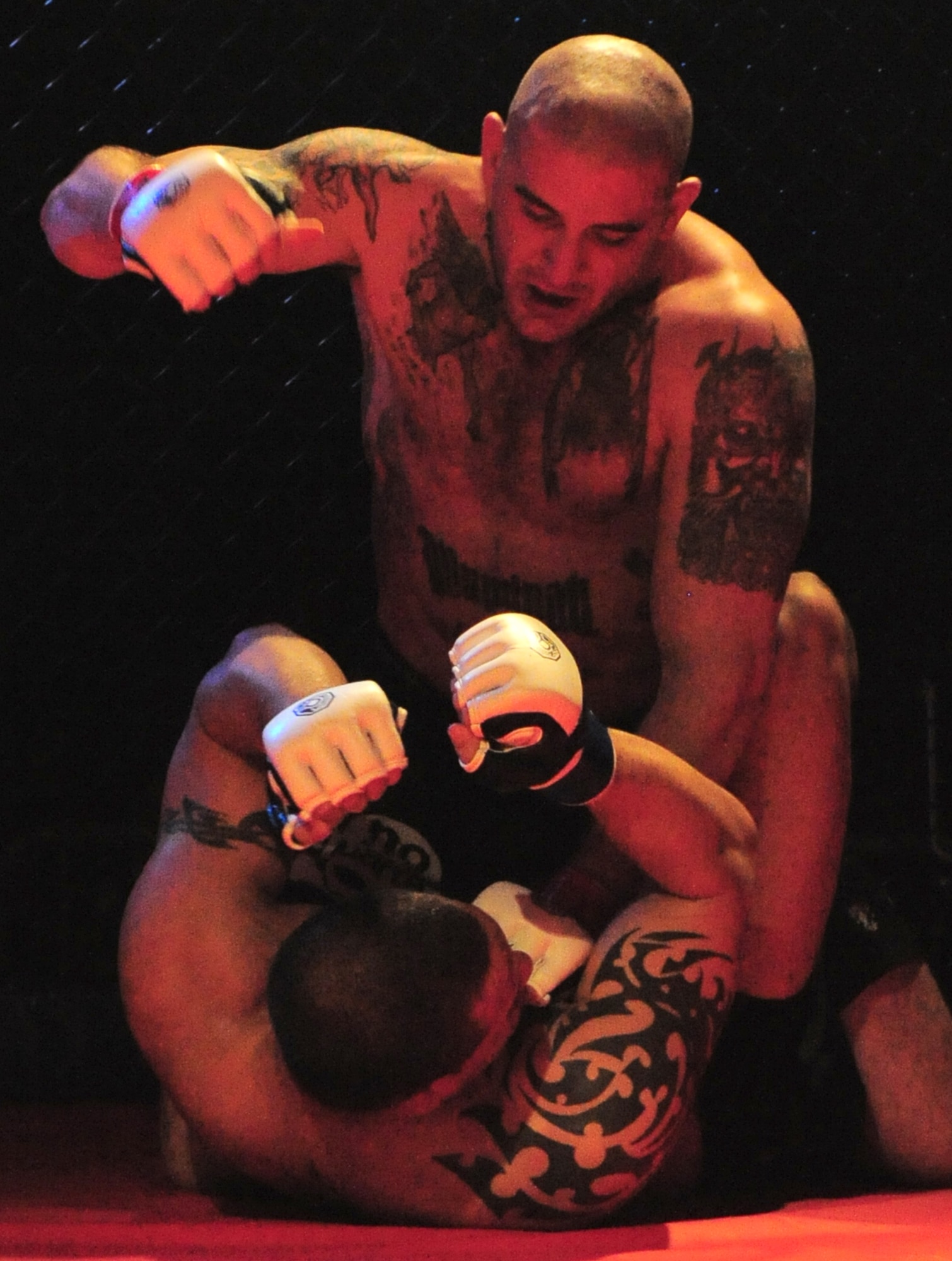 COLUMBIA, S.C. - Staff Sgt. Ferdinando Acerra strikes his opponent after taking him down at the Caged Chaos mixed martial arts competition at Jamil Temple here Feb. 26, 2011. Sergeant Acerra is an F-16 crew chief maintenance instructor for the 20th Maintenance Operations Squadron out of Shaw Air Force Base, S.C. (U.S. Air Force photo/Airman 1st Class Daniel Phelps (Released))
