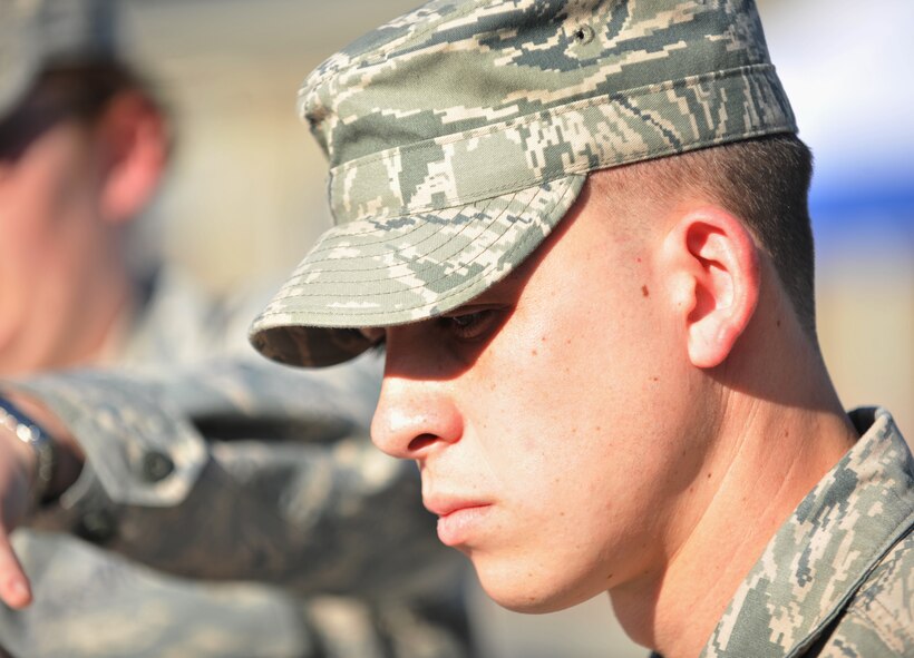 VALDOSTA, Ga.-- Staff Sgt. Andres Jaramillo, 347th Rescue Group intelligence analyst, waits for his plate to be filled during a cookout held for the local community at a ribbon cutting ceremony for the new Skills Success Center in downtown Valdosta Feb. 28. Sergeant Jaramillo said, “ It feels good to give back and interact with the local community.”(U.S. Air Force photo/Airman 1st Class Joshua Green)(RELEASED)
