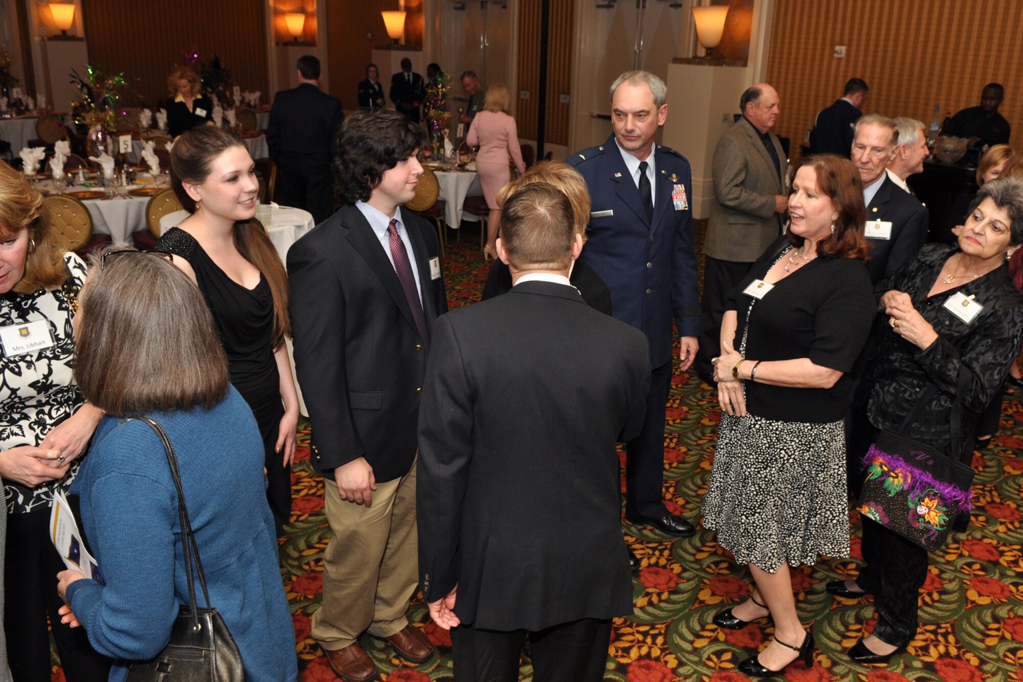 Brig. Gen. John J. Mooney III, commander of the 307th Bomb Wing, Barksdale Air Force, La., and members of his family accept congratulations from friends attending his pinning-on ceremony at the Eldorado Hotel in Shreveport, La., Feb. 25, 2010. Maj. Gen. Frank Padilla, commander of the 10th Air Force was the presiding official for the ceremony. Approximately 70 family members and friends were in attendance, some traveling in from as far away as Maine for the event. (Photo by Jeff Walston)