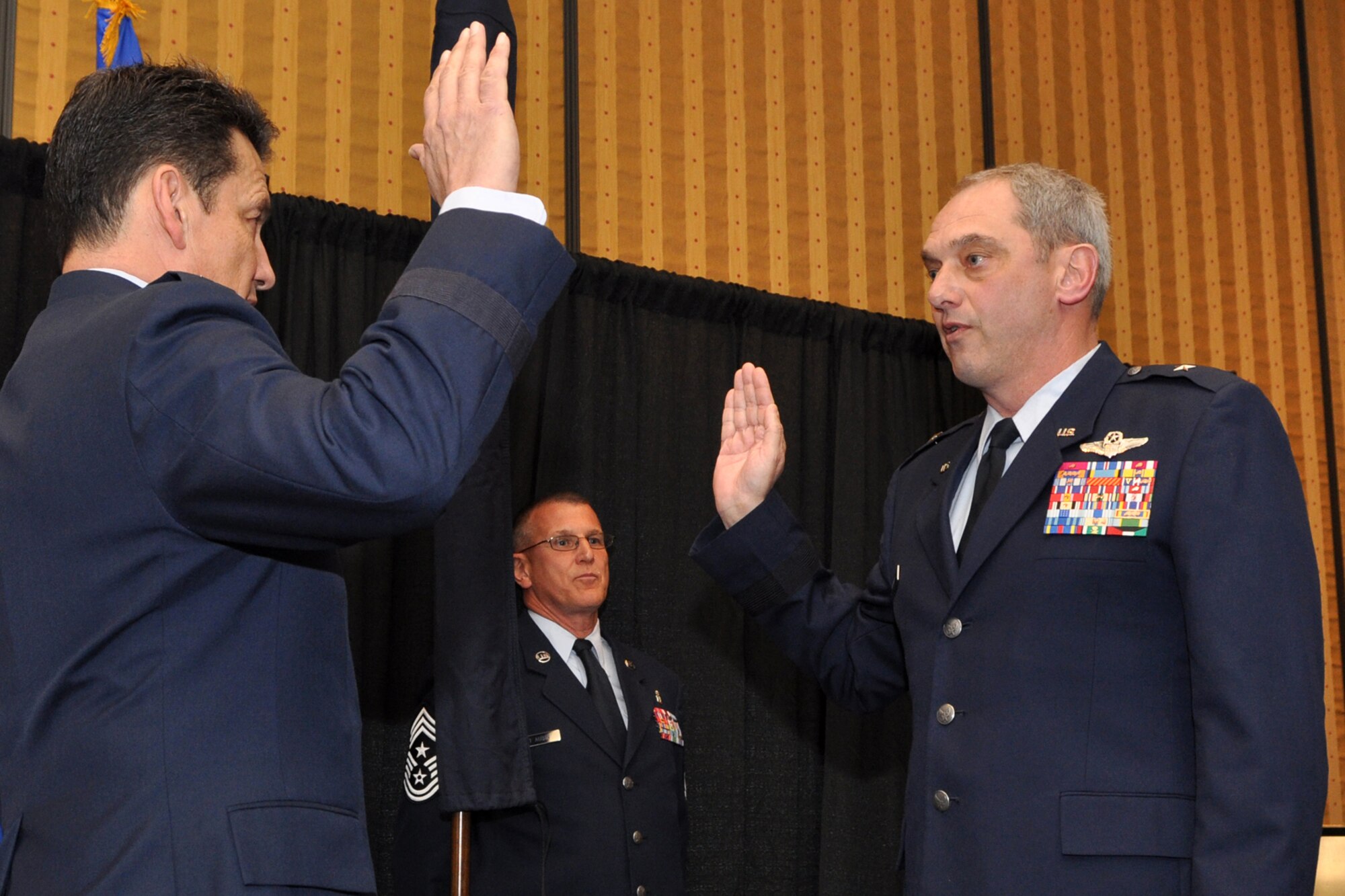 Brig. Gen. John J. Mooney III, commander of the 307th Bomb Wing, Barksdale Air Force Base, La., takes the oath during a pinning-on ceremony at the Eldorado Hotel in Shreveport, La., Feb. 25, 2010. Maj. Gen. Frank Padilla, commander, 10th Air Force, was the presiding official for the ceremony. Approximately 70 family members and friends were in attendance, some traveling in from as far away as Maine for the event. (Photo by Jeff Walston)   