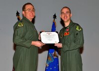MINOT AIR FORCE BASE, N.D. -- Col. Doug Cox, 5th Bomb Wing commander, awarded Capt. Jonathan A. Gunther, 23rd Bomb Squadron B-52H Stratofortress aircraft commander, with the Bronze Star Medal for his meritorious service during Operation Enduring Freedom, at the 5th Operations Group commander's call here Feb. 25. (U.S. Air Force photo/Staff Sgt. Keith Ballard)
