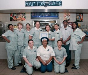 Raptor Cafe food service employees display their certificate of recognition, earned for achieving the facility's fifth consecutive "Excellent" public health rating Feb. 17 at Langley Air Force Base, Va. The award marks the first time the current company earned the honor. Each employee received a $50 gift card for their accomplishments. (Courtesy photo)