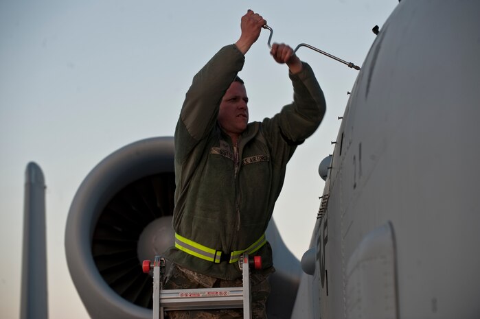 NELLIS AIR FORCE BASE, Nev. --  Senior Airmen Dan Stutts, 127th Maintenance Squadron aerospace propulsion journeymen, Selfridge  Air National Guard Base Mich., opens a panel on an A-10 Thunderbolt II during Red Flag 11-3, Feb. 24.  Red Flag is a realistic combat training exercise involving the air forces of the United States and its allies. The exercise takes place north of Las Vegas on the Nevada Test and Training Range--the U.S. Air Force's premier military training area with more than 12,000 square miles of airspace and 2.9 million acres of land. (U.S. Air Force photo by Tech. Sgt. Michael R. Holzworth)