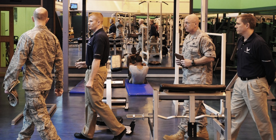 RAF MILDENHALL, England -- Col. James Miner, Staff Sgt. Zachary Rule, Chief Master Sgt. Kyle Robinette and Thomas Harrison (left to right) conduct a walkthrough of the North side Fitness Center here Feb. 25, 2011, as part of an evaluation for the Maj. Gen. Eugene L. Eubank Services Award. Colonel Miner and Chief Robinette are part of the evaluation team surveying the operations of four force support squadrons in the finals for the Air Force-level award. (U.S. Air Force photo/Staff Sgt. Thomas Trower)