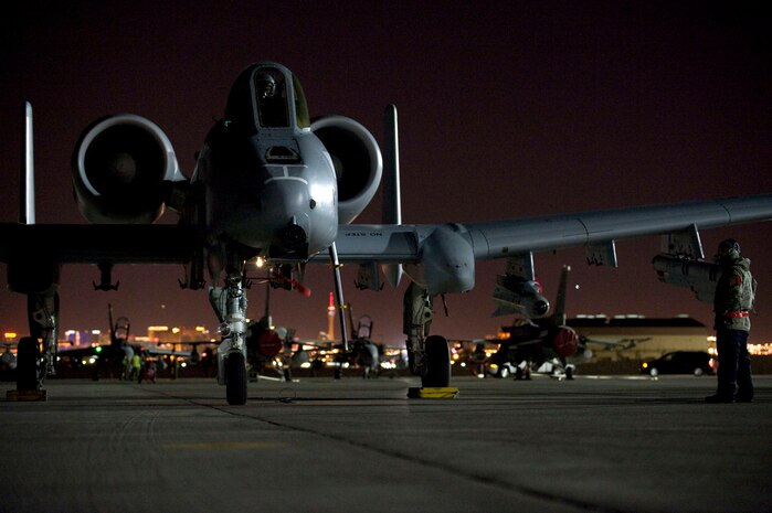 NELLIS AIR FORCE BASE, Nev. --  Staff Sgt. Charles DiCiuccio, 127th Aircraft Maintenance Squadron crew chief, Selfridge  Air National Guard Base Mich., conducts pre-flight checks on an A-10 Thunderbolt II before a training mission during Red Flag 11-3, Feb. 24.  Red Flag is a realistic combat training exercise involving the air forces of the United States and its allies. The exercise takes place north of Las Vegas on the Nevada Test and Training Range--the U.S. Air Force's premier military training area with more than 12,000 square miles of airspace and 2.9 million acres of land.  (U.S. Air Force photo by Airman 1st Class George Goslin)