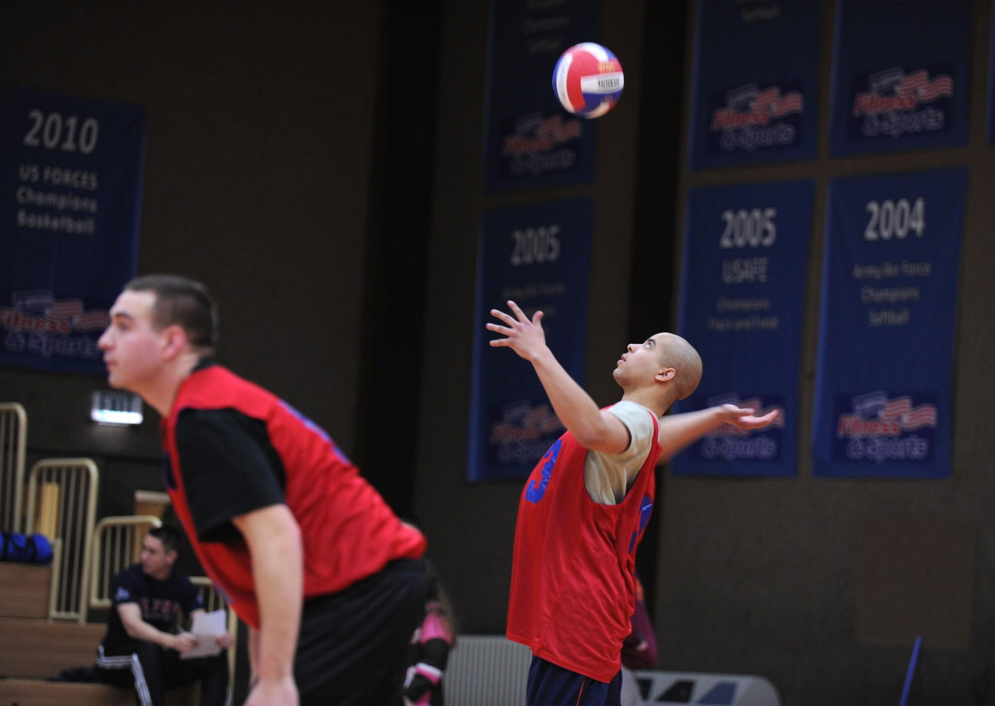 SPANGDAHLEM AIR BASE, Germany –Nicholas Holmes, 52nd Equipment Maintenance Squadron, serves the ball during an intramural volleyball match here Feb. 28. The 52nd EMS defeated the 52nd Fighter Wing Staff Agencies team during the first match of the season.  EMS took the first game 25-23 and the second game 25-14. (U.S. Air Force photo/Senior Airman Nathanael Callon)