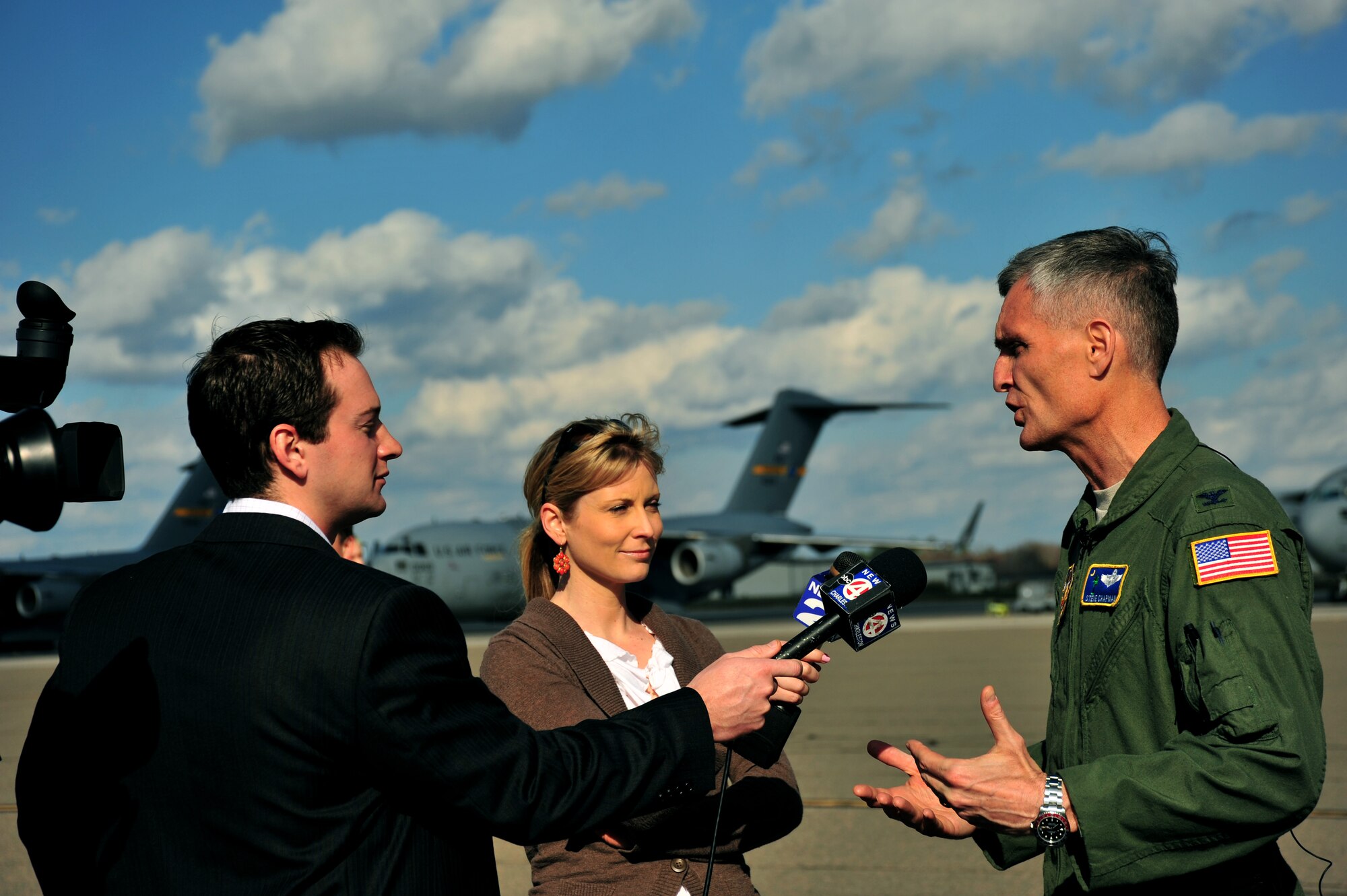 Col. Steve Chapman, 315th Airlift Wing commander, Joint Base Charleston, S.C., gives an interview to local TV station reporters after the arrival of a new C-17 Globemaster III, February 25, 2011. (U.S. Air Force Photo/ Senior Airman Asha McMakin)