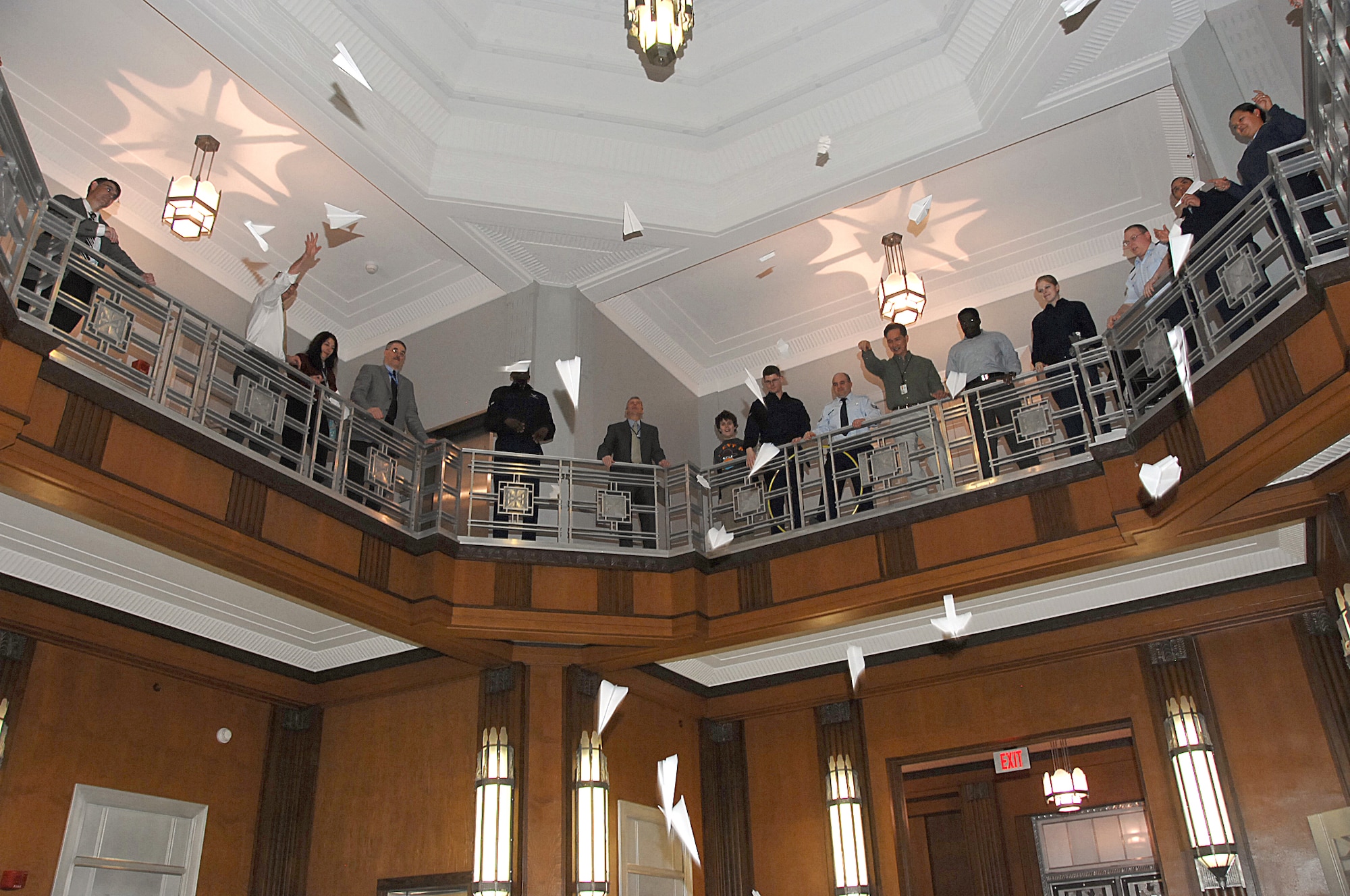 Participants launch their paper airplanes from the second floor of building 12 Rotunda at the Paper Airplane Fly-Off Competition held Feb. 28, 2011 at Wright-Patterson Air Force Base, Ohio.  The event was hosted by Aeronautical Systems Center Agile Combat Support Directorate and brought in over a dozen competitors.  