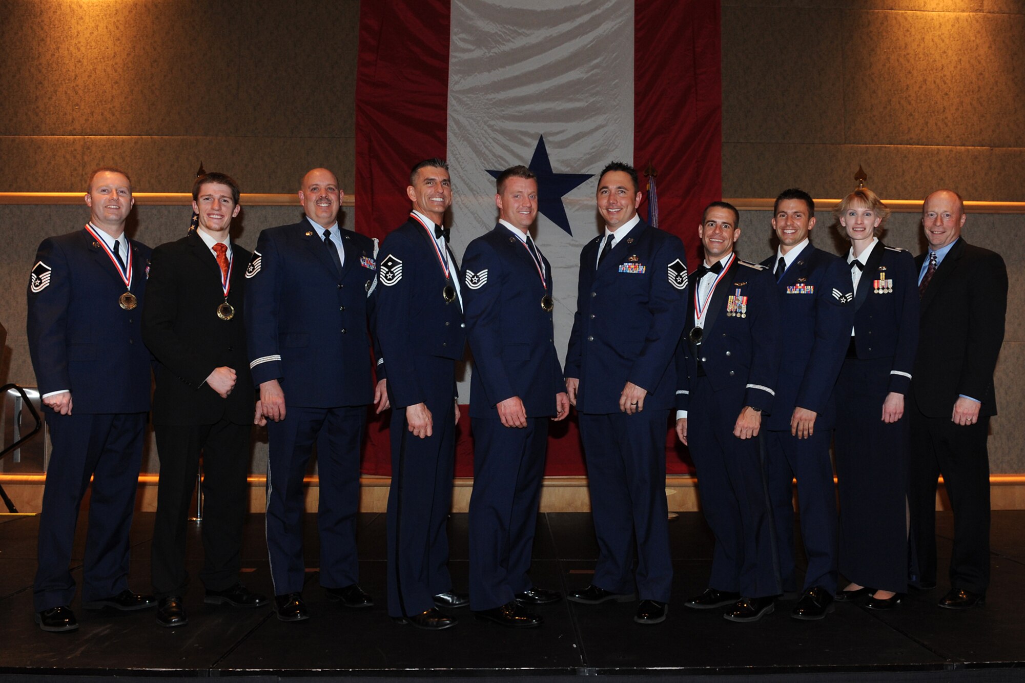 Winners of the 419th Fighter Wing’s Outstanding Airmen of the Year awards include, from left to right, Master Sgt. Drue Titensor, Mr. Cooper Remkes, Master Sgt. Dave Graham, Master Sgt. Chris Sayre, Tech. Sgt. Ronald Beard, Master Sgt. Mark Bates, Capt. Shad Stromberg, Senior Airman Sterling Broadhead, Capt. Jill Stout, and Mr. Brian Cink. Not pictured: Tech. Sgt. Justin Adams. (U.S. Air Force photo/Alex Lloyd)