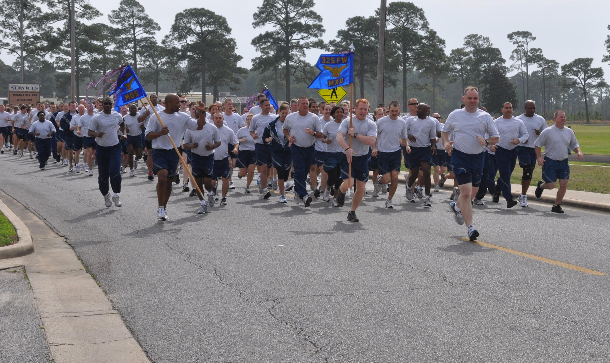 Memebers of the 325th Maintenance Group and the 325th Medical Squadron lead the way for the wing formation run during Winter Wingman Day 2011 Feb. 25. (U.S. Air Force photo/Senior Airman Rachelle Elsea)