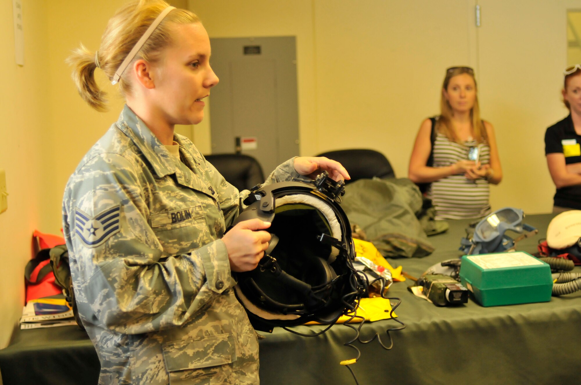 PATRICK AIR FORCE BASE, Fla. - Staff Sgt. Sarah Bolin, aircrew life support technician here, shows Space Coast kindergarteners equipment that she and her team of Air Force Reservists maintain for wing aviators and pararescuemen Feb. 25. The day prior, Airmen from the 920th Rescue Wing were on the go preparing life-saving gear used by Airmen as part of a life-saving effort for NASA astronauts rescue. The reservists are on alert during lift off and until the shuttle returns safely with the astronauts on board. (U.S. Air Force photo/Capt. Cathleen Snow)