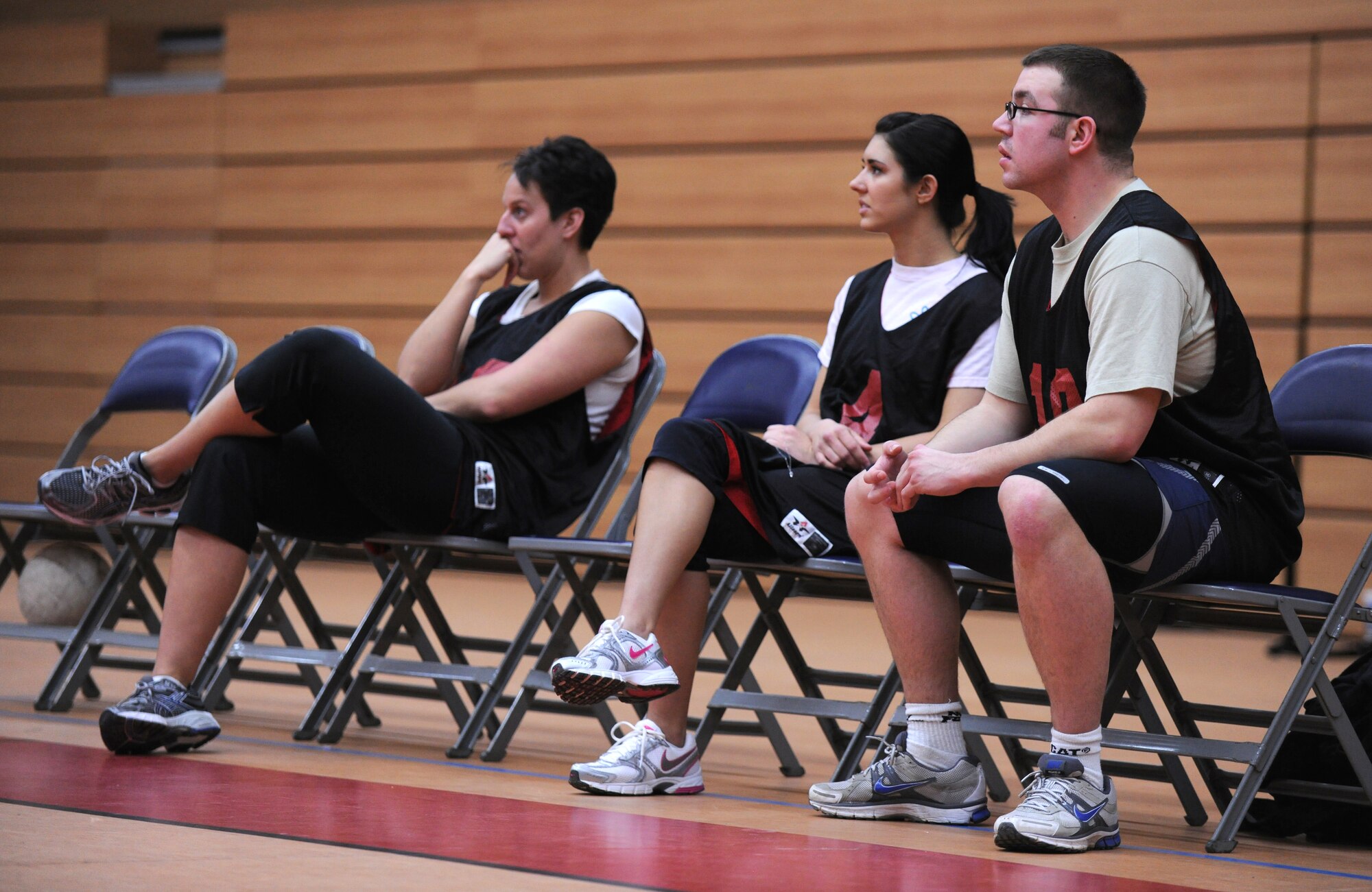 SPANGDAHLEM AIR BASE, Germany – Members of the 52nd Fighter Wing Staff Agencies team watch play during an intramural volleyball match here Feb. 28. The 52nd Equipment Maintenance Squadron defeated the WAS team during the first match of the season.  EMS took the first game 25-13 and the second game 25-14. (U.S. Air Force photo/Senior Airman Nathanael Callon)