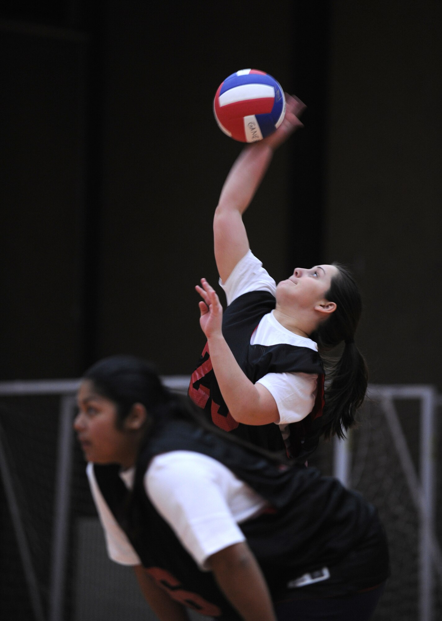 SPANGDAHLEM AIR BASE, Germany – Krystal Lanham, Spangdahlem Area Defense Council, serves the ball during an intramural volleyball match here Feb. 28. The 52nd Equipment Maintenance Squadron defeated the 52nd Fighter Wing Staff Agencies team during the first match of the season.  EMS took the first game 25-23 and the second game 25-14. (U.S. Air Force photo/Senior Airman Nathanael Callon)