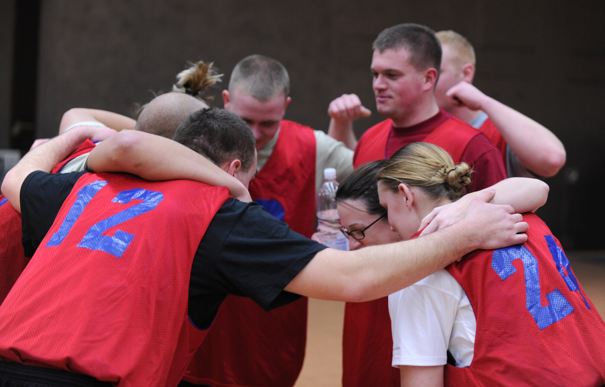 SPANGDAHLEM AIR BASE, Germany – Members of the 52nd Equipment Maintenance Squadron take a timeout to refocus their strategy during an intramural volleyball match here Feb. 28. EMS defeated the 52nd Fighter Wing Staff Agencies team during the first match of the season.  EMS took the first game 25-23 and the second game 25-14. (U.S. Air Force photo/Senior Airman Nathanael Callon)