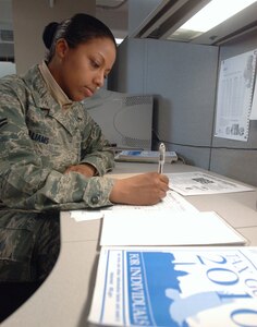 Airman 1st Class Erika Williams, 30th Intelligence Squadron imagery analyst and JBLE Tax Center volunteer, completes Federal income tax forms at the Joint Base Langley-Eustis Tax Center at Langley Air Force Base, Va., Feb. 24, 2011. The Tax Center employs more than 30 Airmen, Soldiers and civilian volunteers at Langley and Fort Eustis locations to provide tax services in accordance with the Internal Revenue Service’s Volunteer Income Tax Assistance program. (U.S. Air Force photo by Airman 1st Class Jason J. Brown/Released)