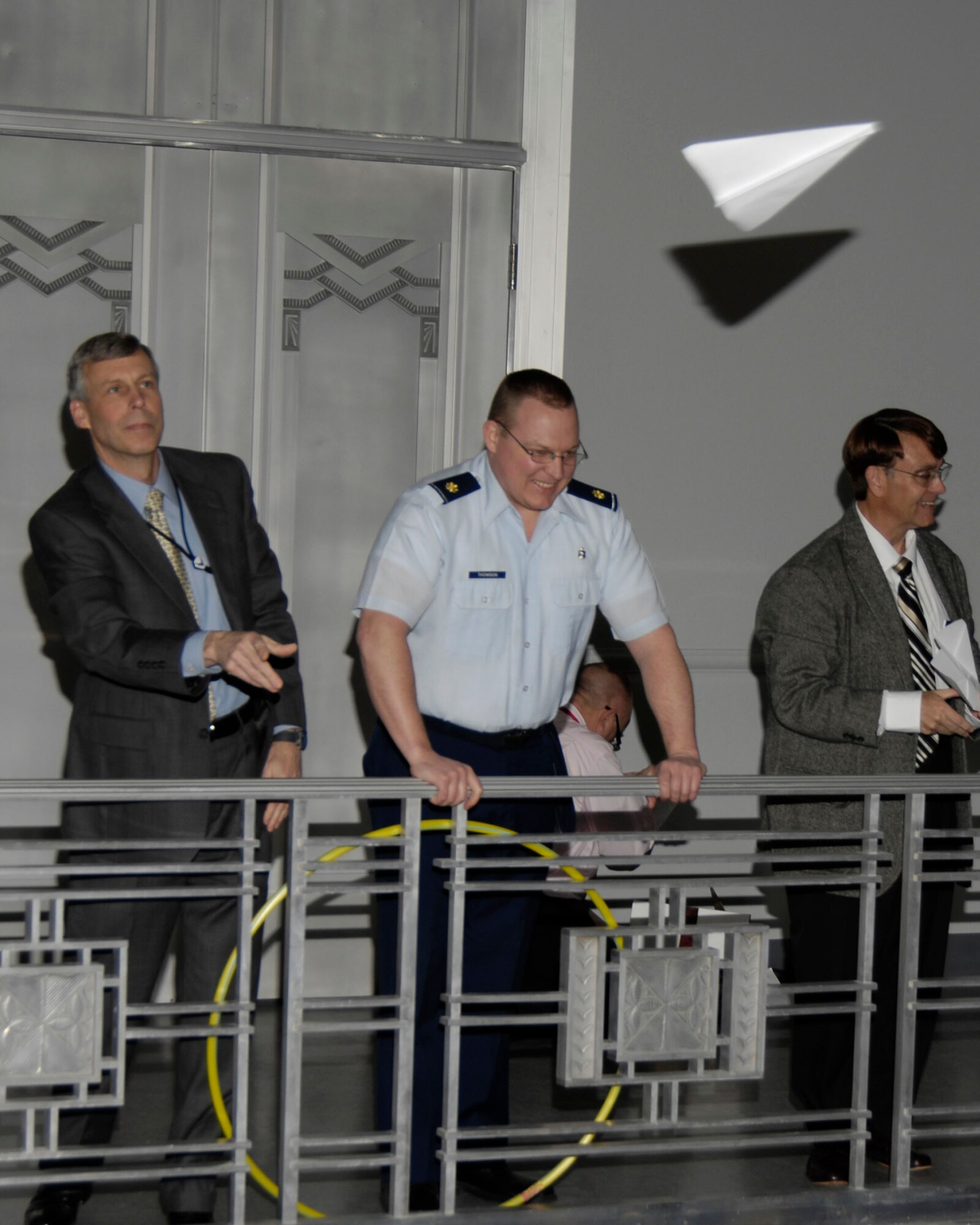 Spectators watch as competitors participate in the Paper Airplane Fly-Off Competition held Feb. 28, 2011 at Wright-Patterson Air Force Base, Ohio.  The event was hosted by Aeronautical Systems Center Agile Combat Support Directorate and brought in over a dozen competitors.  The winners include: Longest Distance Flight Competition (individual): Mike Eviston, ASC Agile Combat Support Directorate – 35.5 feet; Greatest Accuracy Competition (individual): Maj. Scott Thomson, 88th Dental Squadron – 15 inches; Longest Flight Time Competition (individual):  Stafford Fox, Agile Combat Support Directorate – 7.09 seconds; Aerobatic Flight Competition (individual): Mike Eviston, ASC Agile Combat Support Directorate; Speed/Accuracy Challenge (Team): The Other Guys, 88th Dental Squadron – Maj. Scott Thomson, TSgt Alecia Weibel, SSgt Carlos Castaneda. (U.S. Air Force photo/Michelle Gigante)
