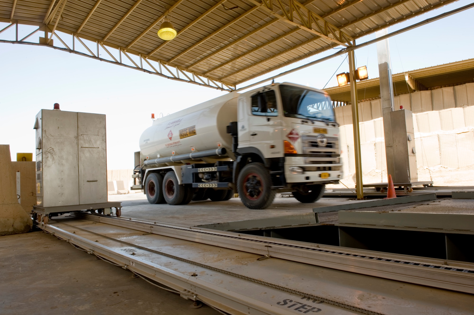 BAGHDAD -- A water truck drives into the vehicle inspection area where a relocatable Vehicle and Cargo Inspection System was installed Feb. 24.  The VACIS is a recent addition to the Sather Air Base vehicle inspection arsenal and increases the capability to provide security to the base. (U.S. Air Force photo by Staff Sgt. Levi Riendeau)

