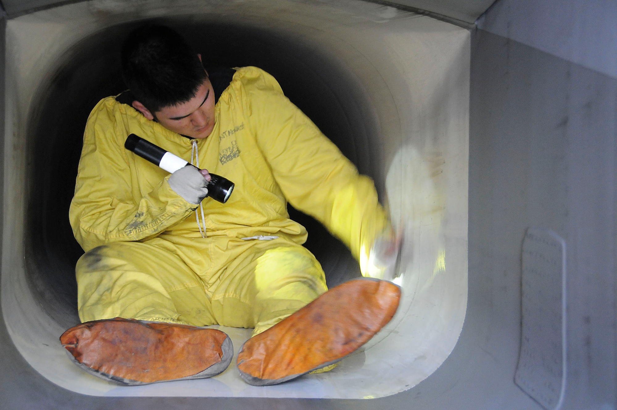 Senior Airman Daniel Liederbach, 44th Aircraft Maintenance Unit crew chief, inspects the intake of an F-15 Eagle during Beverly High 11-03, a local operational readiness exercise at Kadena Air Base, Japan, March 1. These inspections allow crew chiefs to determine whether there were any problems caused during flight and fix them to improve mission readiness. (U.S. Air Force photo/ Staff Sgt. Darnell T. Cannady)