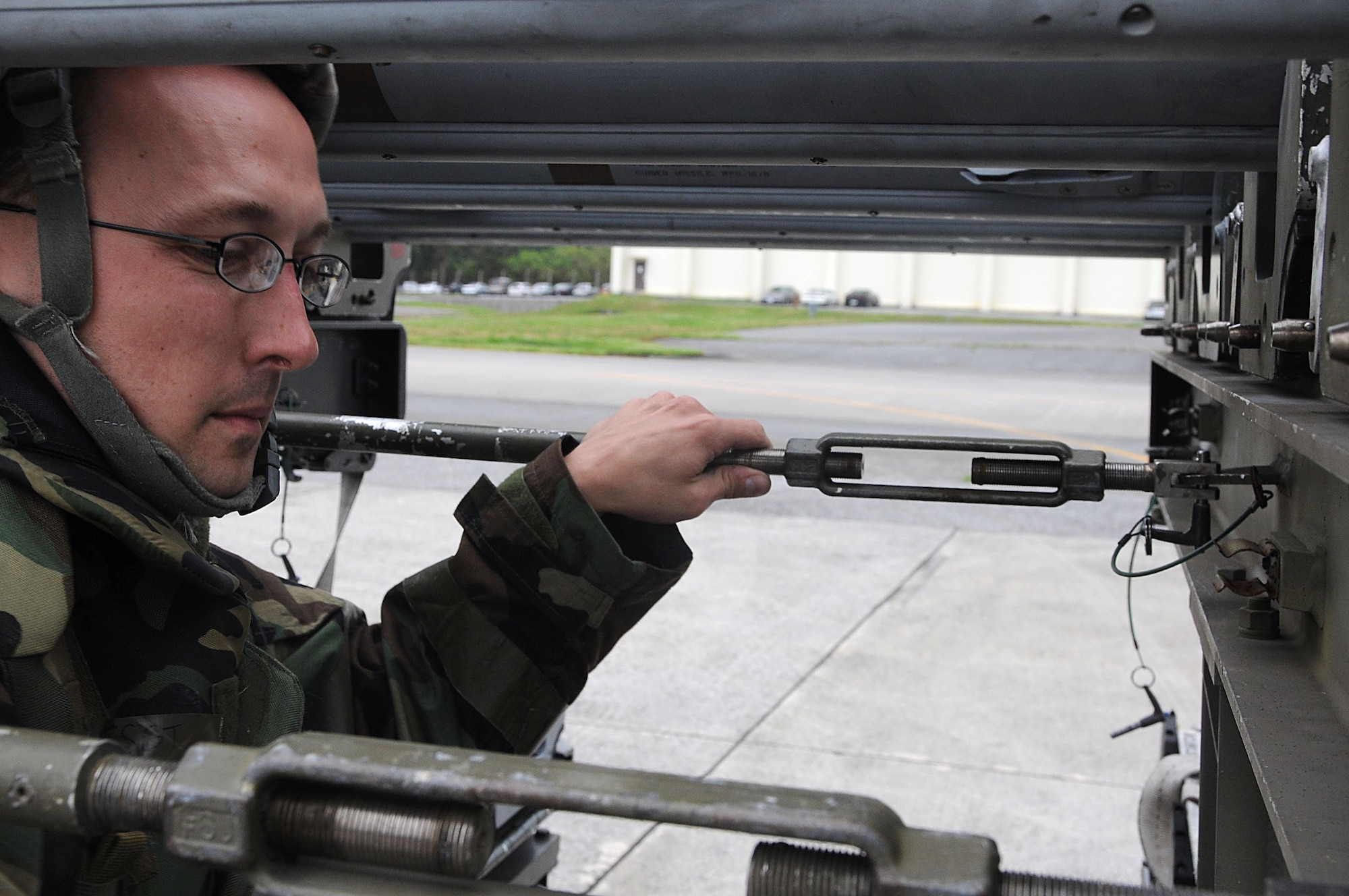 Staff Sgt. Cale Seubert, 18th Munitions Squadron munitions inspector, inspects the munitions trailer to ensure everything is fastened properly during Beverly High 11-03, a local operational readiness exercise at Kadena Air Base, Japan, March 1. The exercise tested Team Kadena's ability to operate and complete the mission during a multitude of contingency scenarios. (U.S. Air Force photo/ Staff Sgt. Darnell T. Cannady)