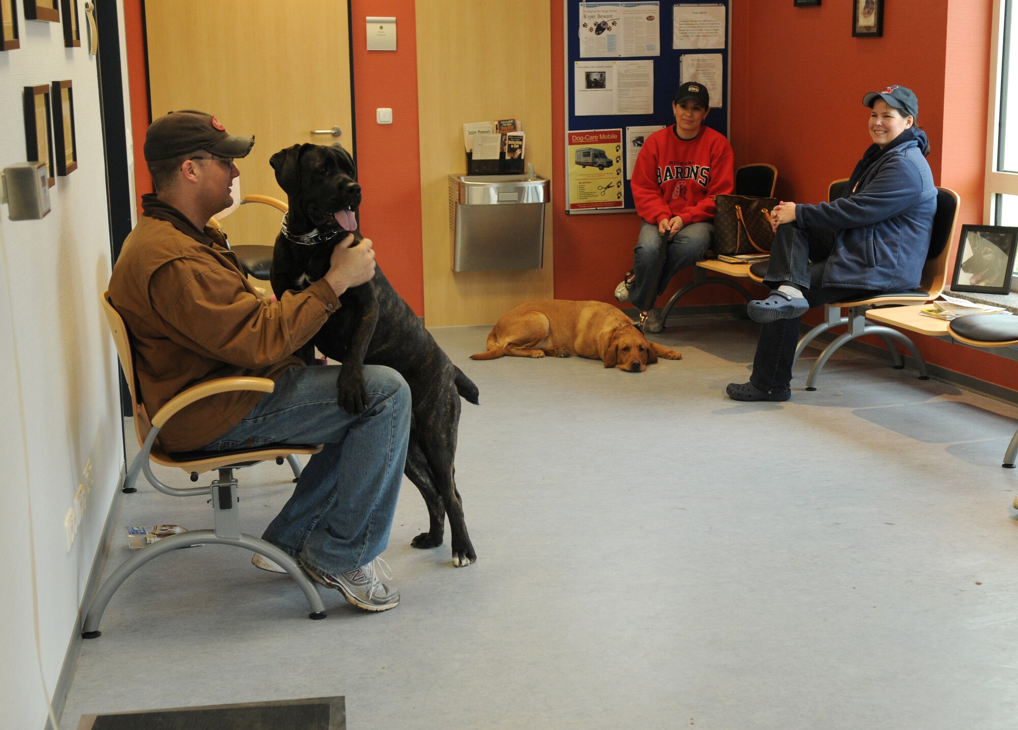 SPANGDAHLEM AIR BASE, Germany – Pets wait with their owners to see the veterinarian for the vaccine clinic here Feb. 26. The Spangdahlem Veterinary Clinic hosted the vaccine clinic to help Sabers keep their pets healthy. The veterinary clinic’s primary mission is to provide treatment for military working dogs on base, but they treat pets on a limited basis. (U.S. Air Force photo/Senior Airman Nathanael Callon)