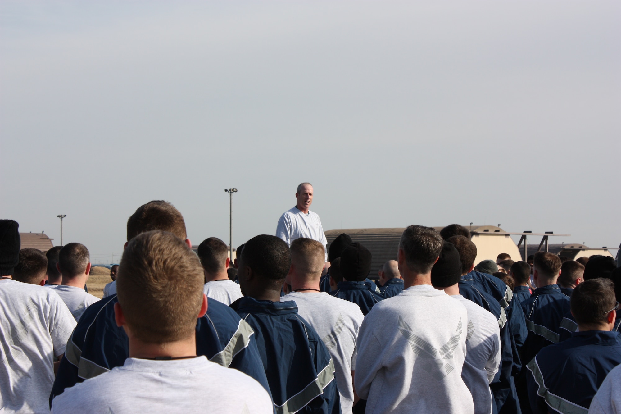 KUNSAN AIR BASE, Republic of Korea -- Lt. Col. Michael Allison, 8th Aircraft Maintenance Squadron commander, rallies his team after a successful run down the flight line here as their team-building exercise during Winter Wingman Day 2011 Feb. 25. A day celebrated around the Air Force, Wingman Day was meant to reinforce the wingman concept as the foundation to building resilient Airmen. (U.S. Air Force photo/Master Sgt. Junius Marshall III)