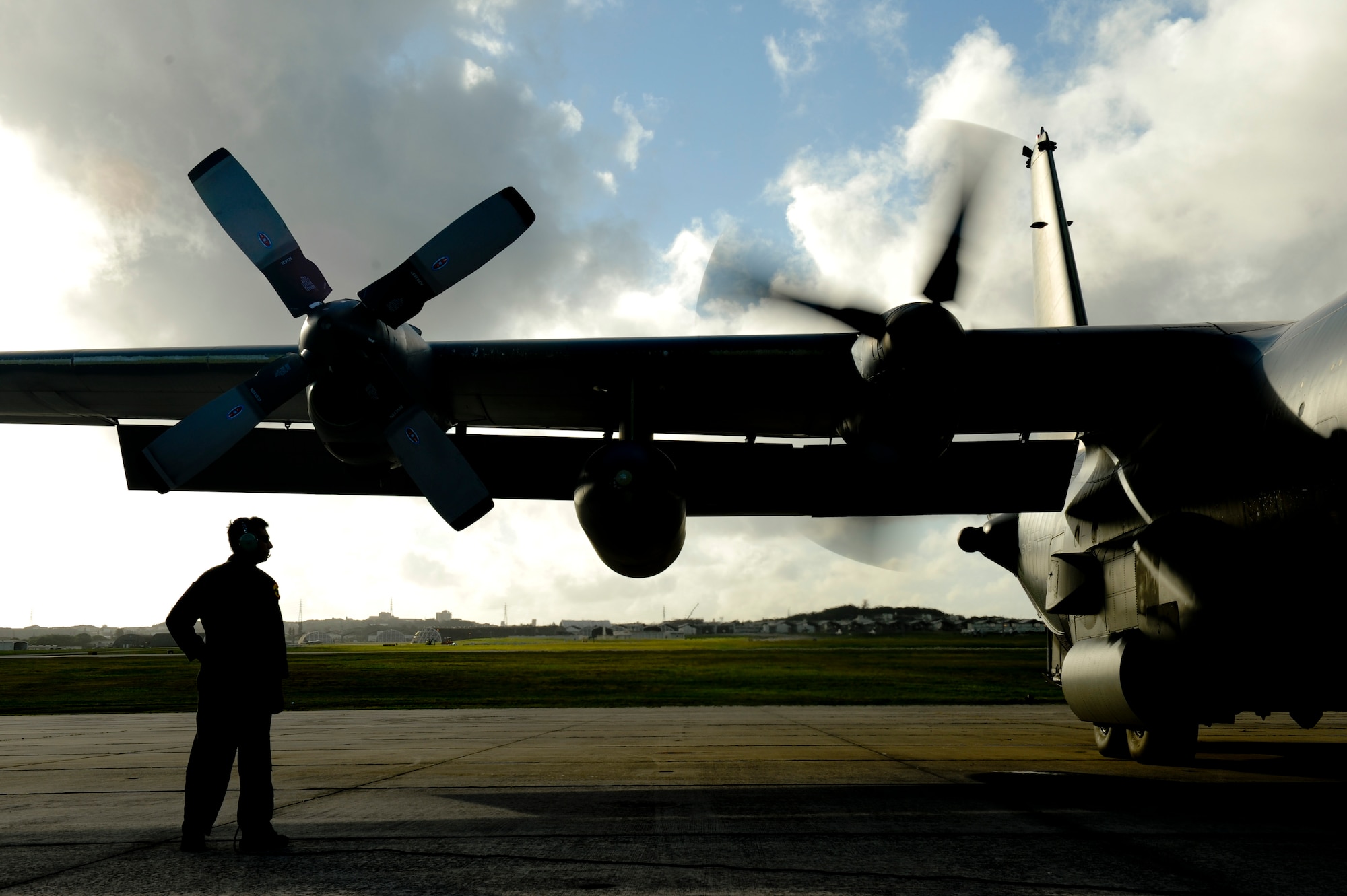 Senior Master Sgt. Randy Perreault, a loadmaster with the 1st Special Operations Squadron at Kadena Air Base, Japan, watches as a MC-130H Combat Talon II starts its’ engines Feb. 26. This tribute venerated brethren lost 30 years ago when a 1st SOS MC-130E, call sign Stray 59, crashed during a training exercise near the Philippines. (U.S. Air Force photo/Staff Sgt. Jonathan Steffen)