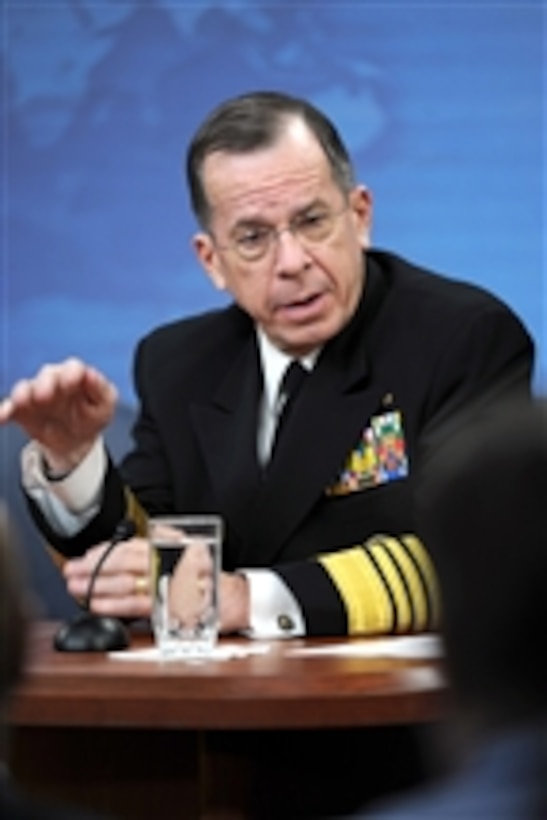 Chairman of the Joint Chiefs of Staff Adm. Mike Mullen responds to a reporter's question during a press conference with Secretary of Defense Robert M. Gates in the Pentagon on March 1, 2011.  