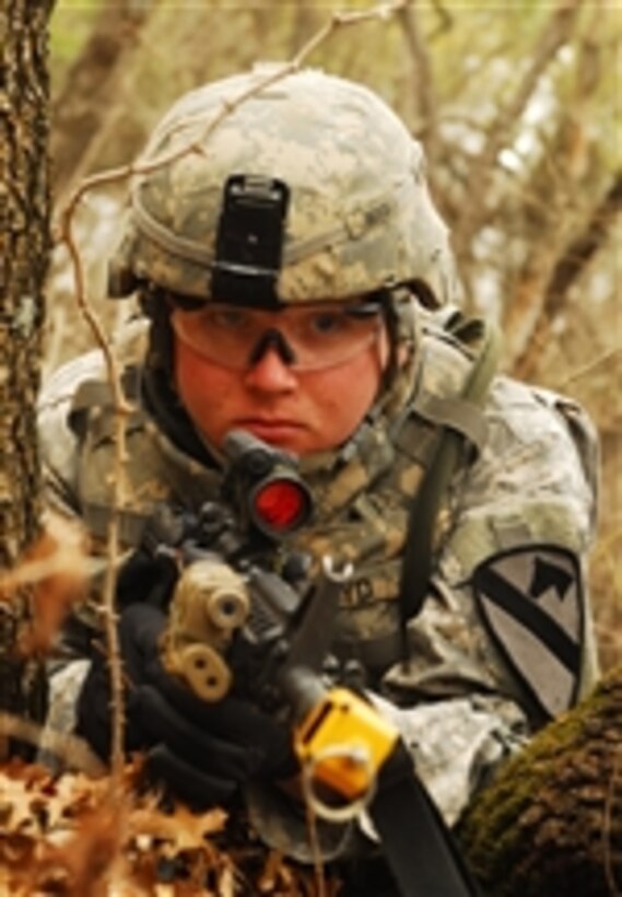 U.S. Army Pvt. Zach Mecthel, an infantryman with 1st Battalion, 8th Cavalry Regiment, 2nd Brigade Combat Team, 1st Cavalry Division, watches for enemy movement during training at Fort Hood, Texas, on Feb. 16, 2011.  