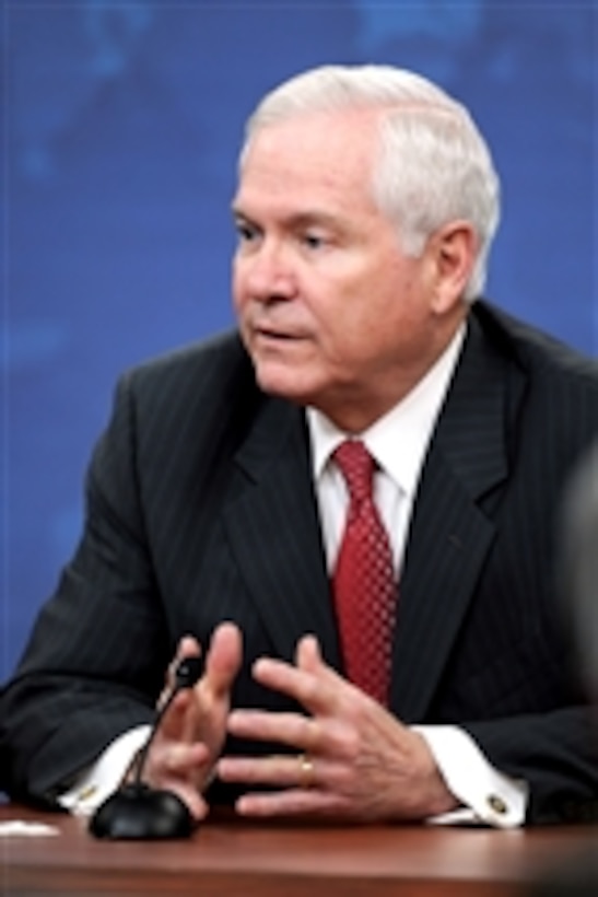 Secretary of Defense Robert M. Gates responds to a reporter's question during a press conference with Chairman of the Joint Chiefs of Staff Adm. Mike Mullen in the Pentagon on March 1, 2011.  