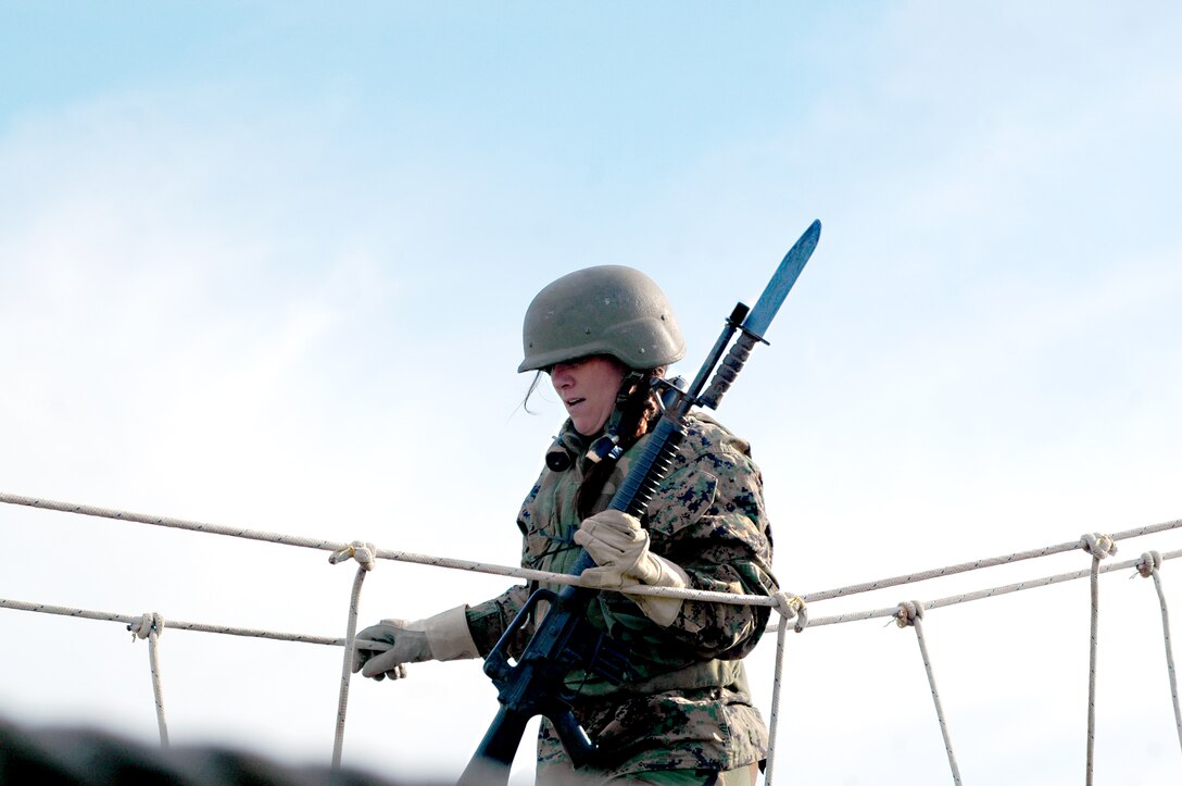 Counselor Rory Ralston walks the rope bridge on the Marine Corps Recruit Depot obstacle course March 1, 2011. Ralston is here from Evergreen High School in Evergreen, Colo. High school administrators, teachers, counselors and media from Recruiting Stations Denver and Phoenix participated in a week-long synopsis of Marine Corps recruit training during the Educators Workshop.