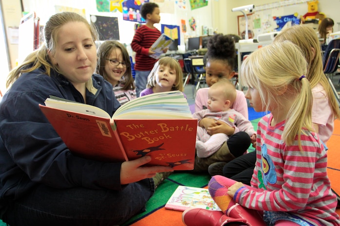 Angela Creason, parent reader, reads “The Butter Battle Book” by Dr. Seuss to Matthew C. Perry Elementary students in their classroom here March 2. M.C. Perry Elementary school children and parents celebrated Dr. Seuss’s birthday by reading their favorite Dr. Seuss books together.