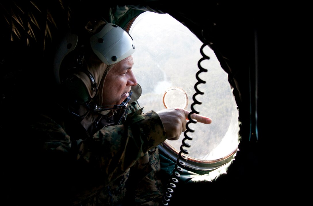 A Marine with II Marine Expeditionary Force’s Enabler Team keeps a watchful eye on the terrain ahead as his convoy bounds systematically to neutralize targets March 2, 2011, during a motorized operations training exercise.