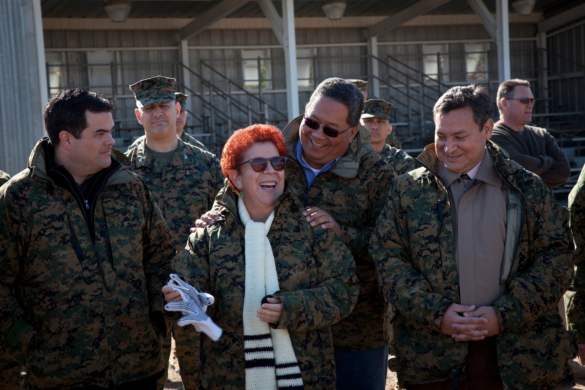 Senators Judith P. Guthertz and Frank Blas Jr., joke about firing rifles at Marine Corps Base Quantico, Va., during their tour of various ranges March 2, 2011. The legislatures visited the Pentagon and toured the base to gather an understanding of the types of ranges planned for a new Marine Corps base on Guam. The live fire ranges planned for construction on Guam are a known distance (KD) rifle range, KD pistol range, 1000m automated multi-purpose machinegun (MPMG) range, modified record firing range (MRFR), 100m non-standard small arms range and live hand grenade range.