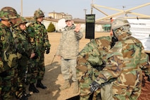 KUNSAN AIR BASE, Republic of Korea -- Staff Sgt. Charles Walker, 8th Civil Engineer Squadron readiness and emergency management flight training NCO, teaches ROKAF members the proper way to decontaminate themselves at a chemical, biological, radiological and nuclear incident decontamination station during an exercise held bilaterally by the 8th CES and 38th Fighter Group here March 2. The training was designed to teach ROKAF members the proper way to sanitize themselves after becoming contaminated in a CBRN environment. (U.S. Air Force photo/Tech. Sgt. Jonathan Pomeroy) 
