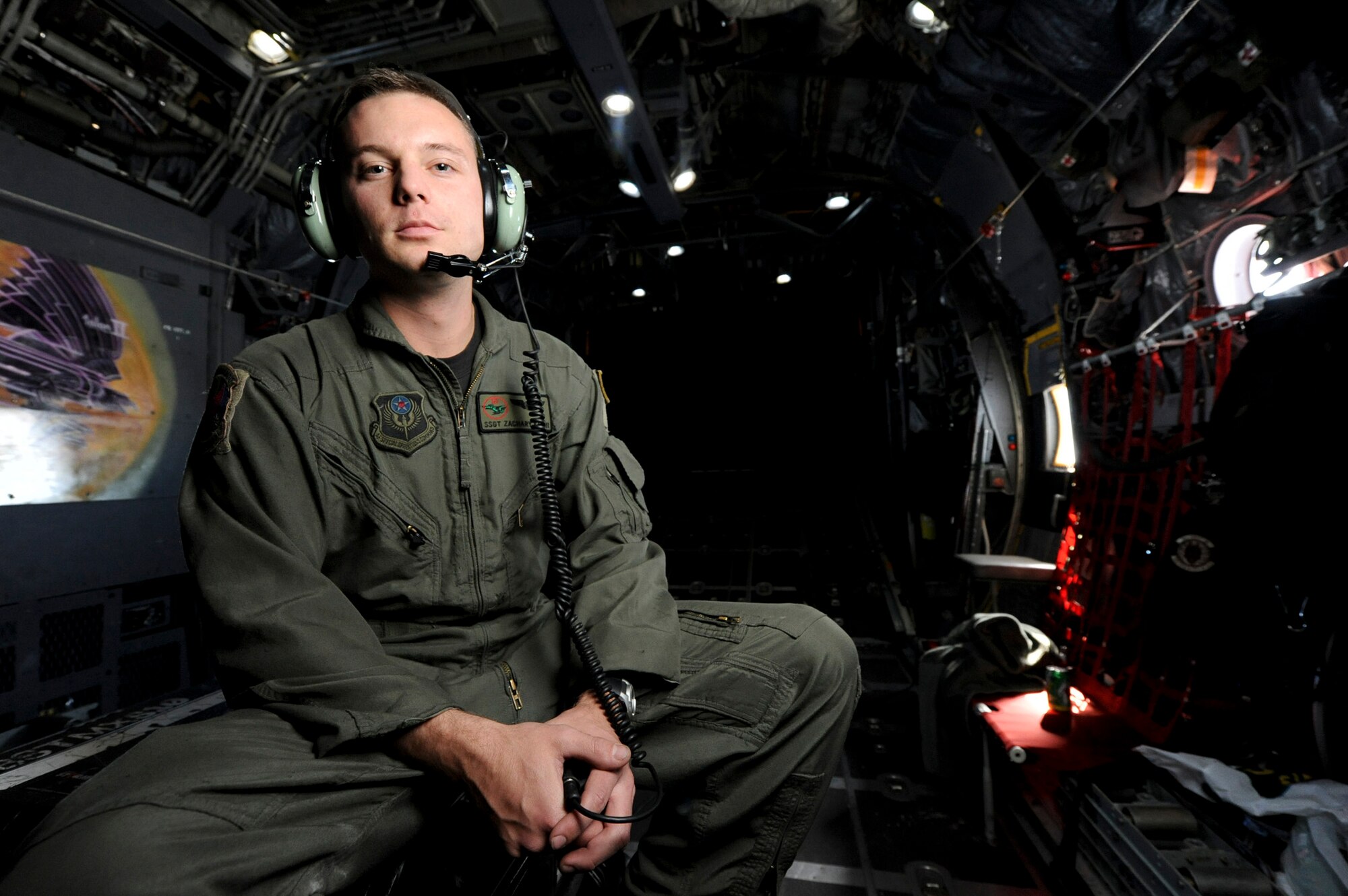 Staff Sgt. Zachary Kelhi, a loadmaster with the 1st Special Operations Squadron, assisted in the release of a wreath from an MC-130H Combat Talon II Feb. 26, 2011, in memory of fallen brethren lost 30 years ago, when a 1st SOS MC-130E, call sign STRAY 59, crashed during an exercise, killing eight crewmembers and 15 passengers. (U.S. Air Force photo/Staff Sgt. Jonathan Steffen)