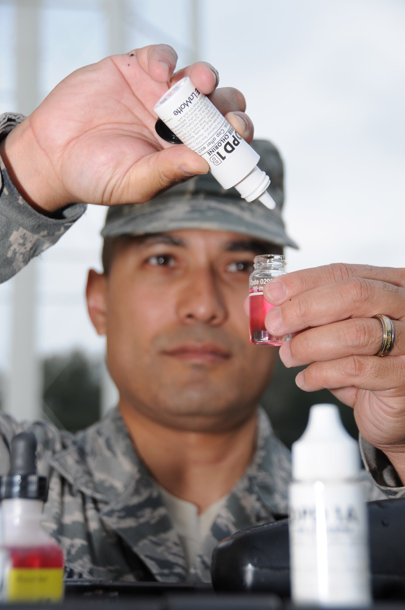 Staff Sgt. BillyWince, 81st Aerospace Medicine Squadron, tests a water sample from a well in East Falcon Park Monday. The Mississippi State Department of Health issued a boil-water notice for the base Feb. 21. Ten routine samples are sent to the MSDH lab each month. When one sample tested positive for coliform, the base was required to submit 24 samples free of total coliform for two consecutive days for the boil water notice to be lifted. As of Tuesday, the notice remained in effect.  (U.S. Air Force photo by Kemberly Groue)
