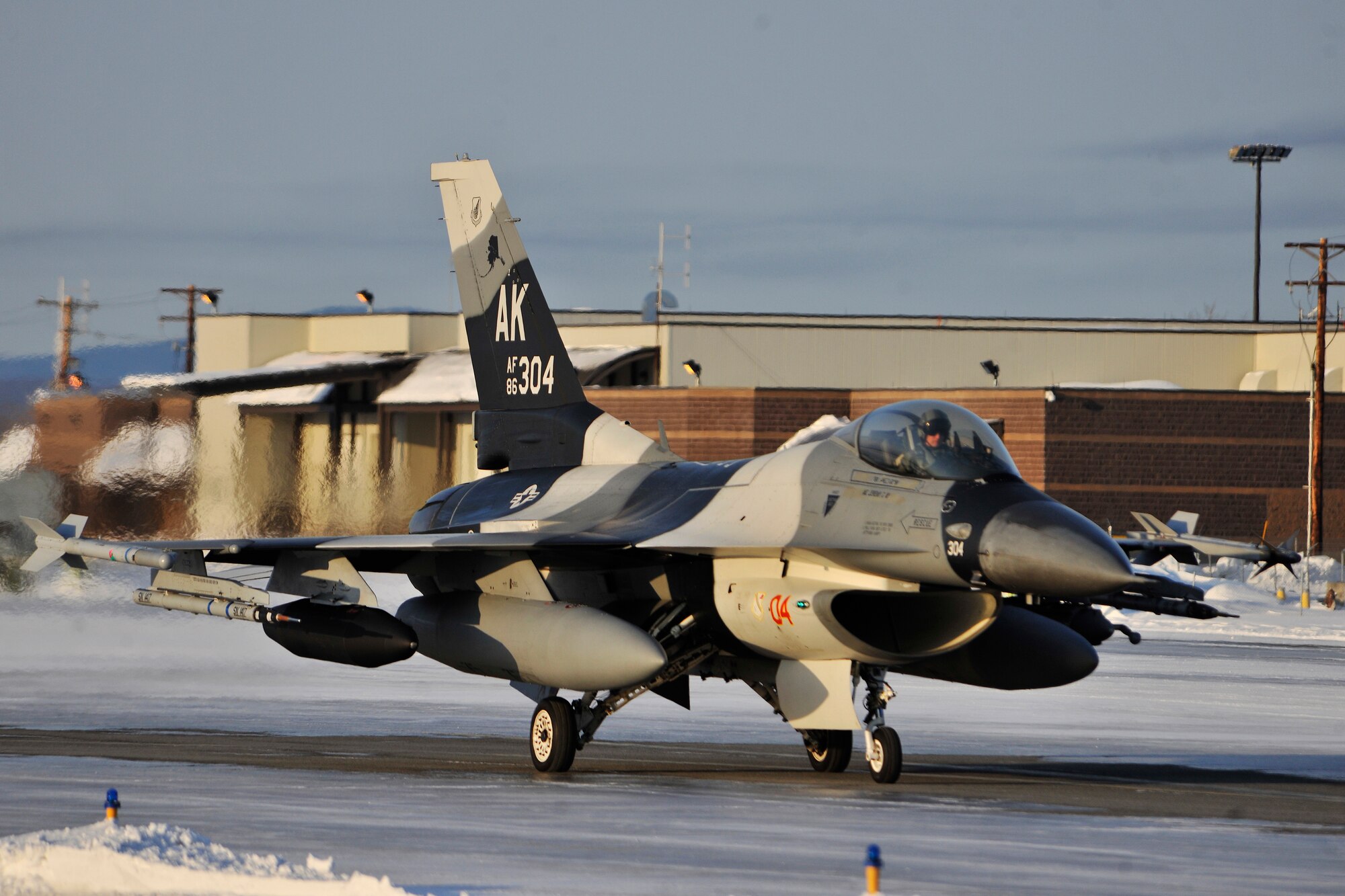 Brig. Gen. James N. Post III taxis an F-16 Fighting Falcon Aggressor on the flightline March 1, 2011, Eielson Air Force Base, Alaska. The Aggressors returned from Andersen Air Force Base, Guam after participating in a two week long exercise conducted by the U.S. and Japan. General Post is the 354th Fighter Wing commander. (U.S. Air Force photo/Staff Sgt. Christopher Boitz)