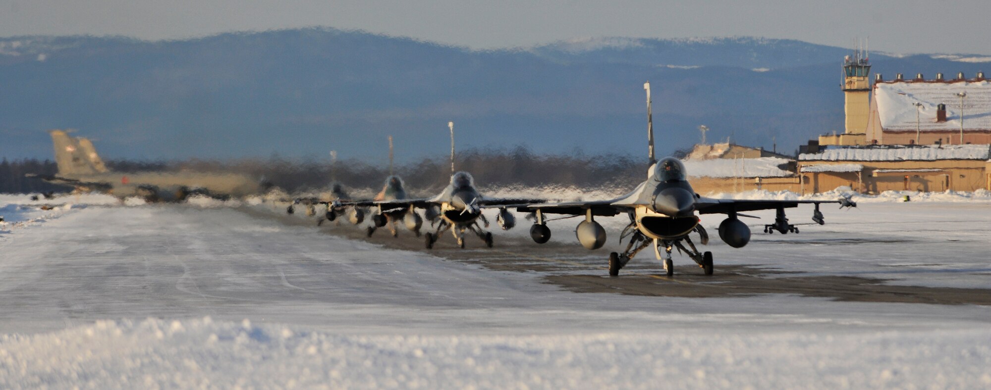 F-16 Fighting Falcon Aggressors taxi on the flightline March 1, 2011, Eielson Air Force Base, Alaska. The Aggressors returned from Andersen Air Force Base, Guam after participating in a two week long exercise conducted by the U.S. and Japan. (U.S. Air Force photo/Staff Sgt. Christopher Boitz)