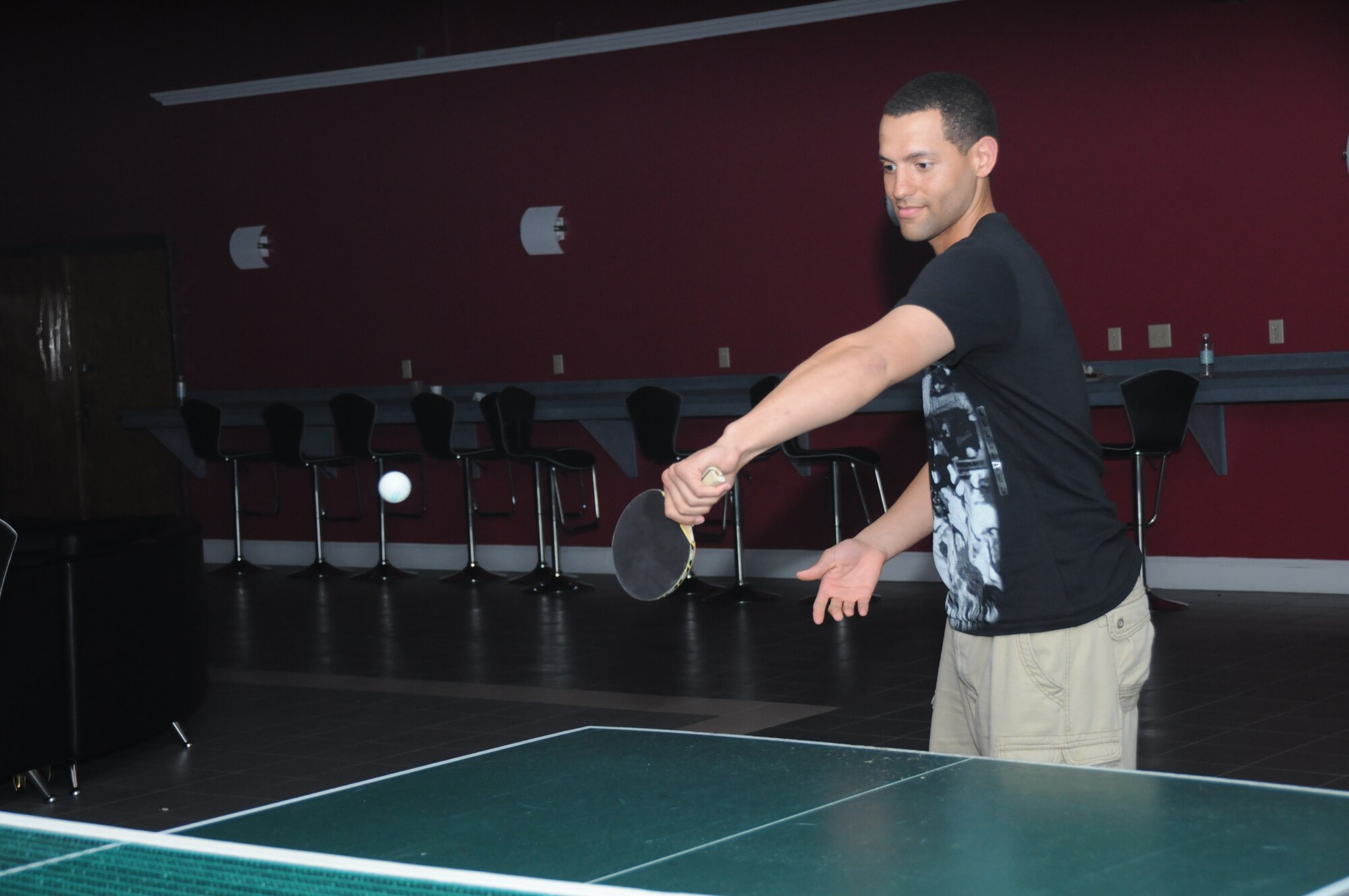 Airman Delbert Simmons, 336th Training Squadron, enjoys a game of ping pong with a fellow student at the reopening of the Vandenberg Community Center, Feb. 25.  (U.S. Air Force photo by Kemberly Groue)