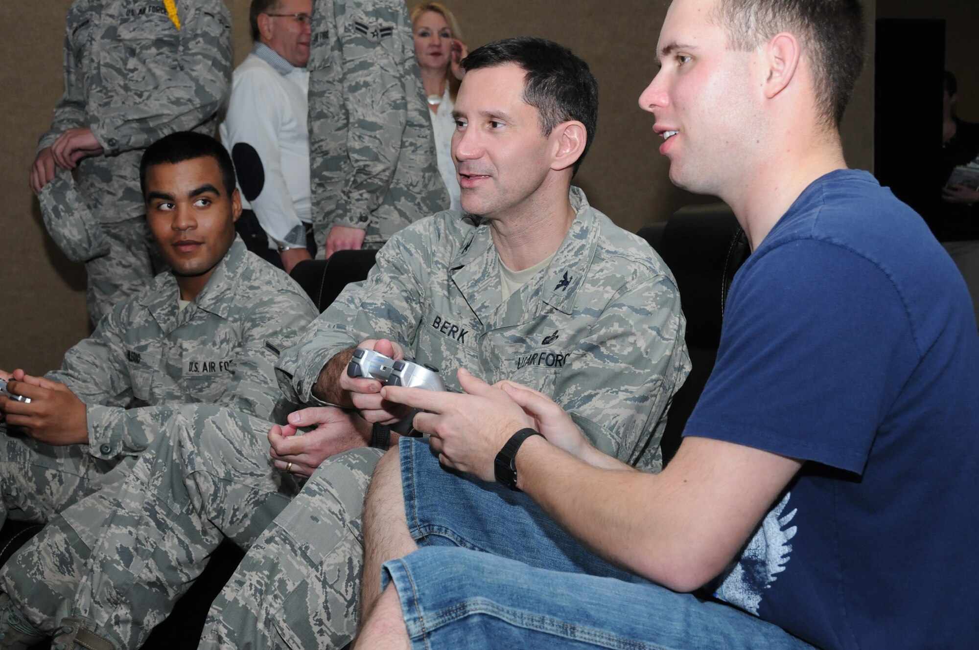 From left, Airman Edwin Hilerio, Col. Rodney Berk and Airman Basic Keith Nelson play games in the new video room. Colonel Berk is the 81st Mission Support Group commander and Airmen Hilerio and Nelson are students in the 335th TRS. The refurbished facility includes new paint, carpet, furniture, sound system, computer
and gaming room, classroom, patio, movie room, piano, televisions and gaming equipment.  (U.S. Air Force photo by Kemberly Groue)