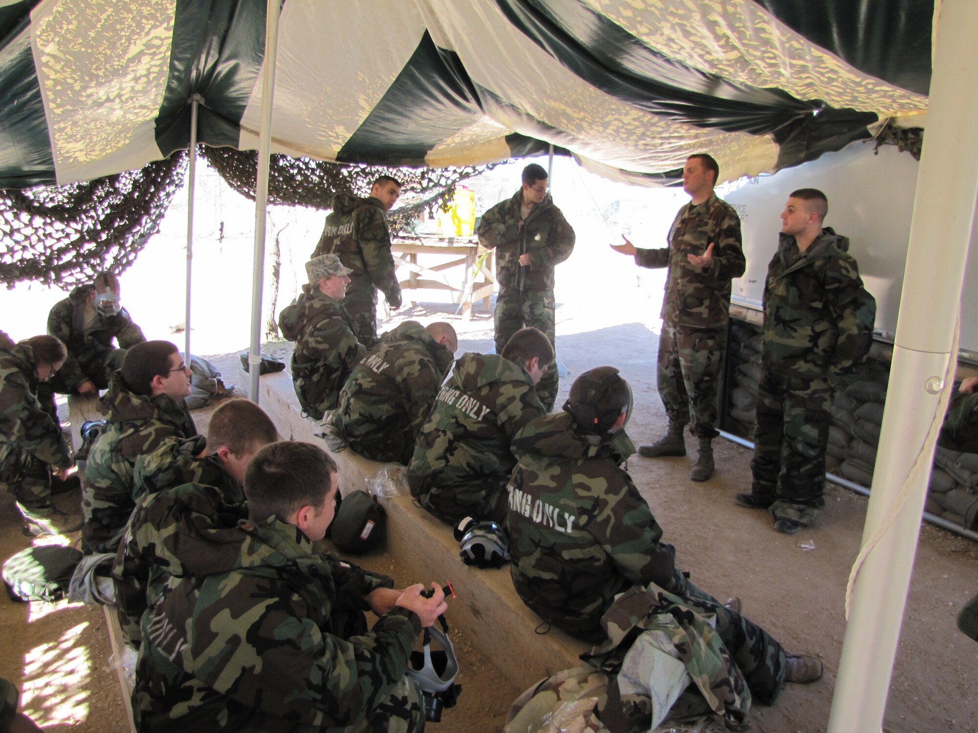 GOODFELLOW AIR FORCE BASE, Texas - Cadets from the Air Force Reserve Officer Training Corps, Angelo State University, receive training on how to wear Mission Oriented Protective Posture gear Feb. 25 at the Forward Operating Base Camp Sentinel. This was part of a two day training session designed to teach them what military life entails. (Courtesy photo) 